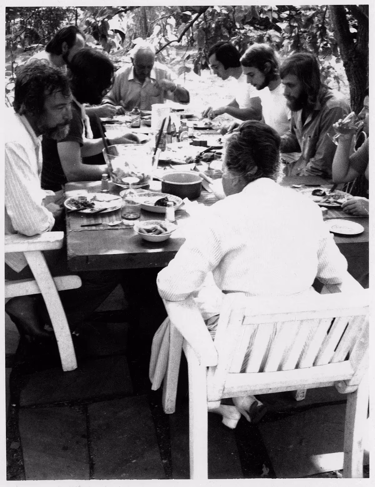Jasper Johns eating lunch with Tatyana and Maurice Grosman and ULAE staff outside of the studio at Skidmore Place