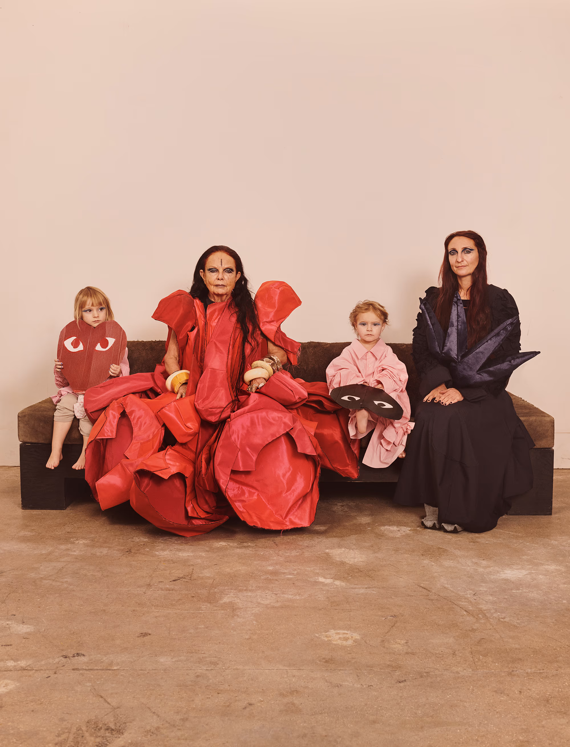 Michèle Lamy wears archival dress by COMME DES GARÇONS and mask by BUERLANGMA. Nicée Lucia and Petra Lune wear shirts by COMME DES GARÇONS COMME DES GARÇONS and masks by STEPHANIE K KANE. Scarlett Rouge wears full look by COMME DES GARÇONS COMME DES GARÇONS and mask by BUERLANGMA.