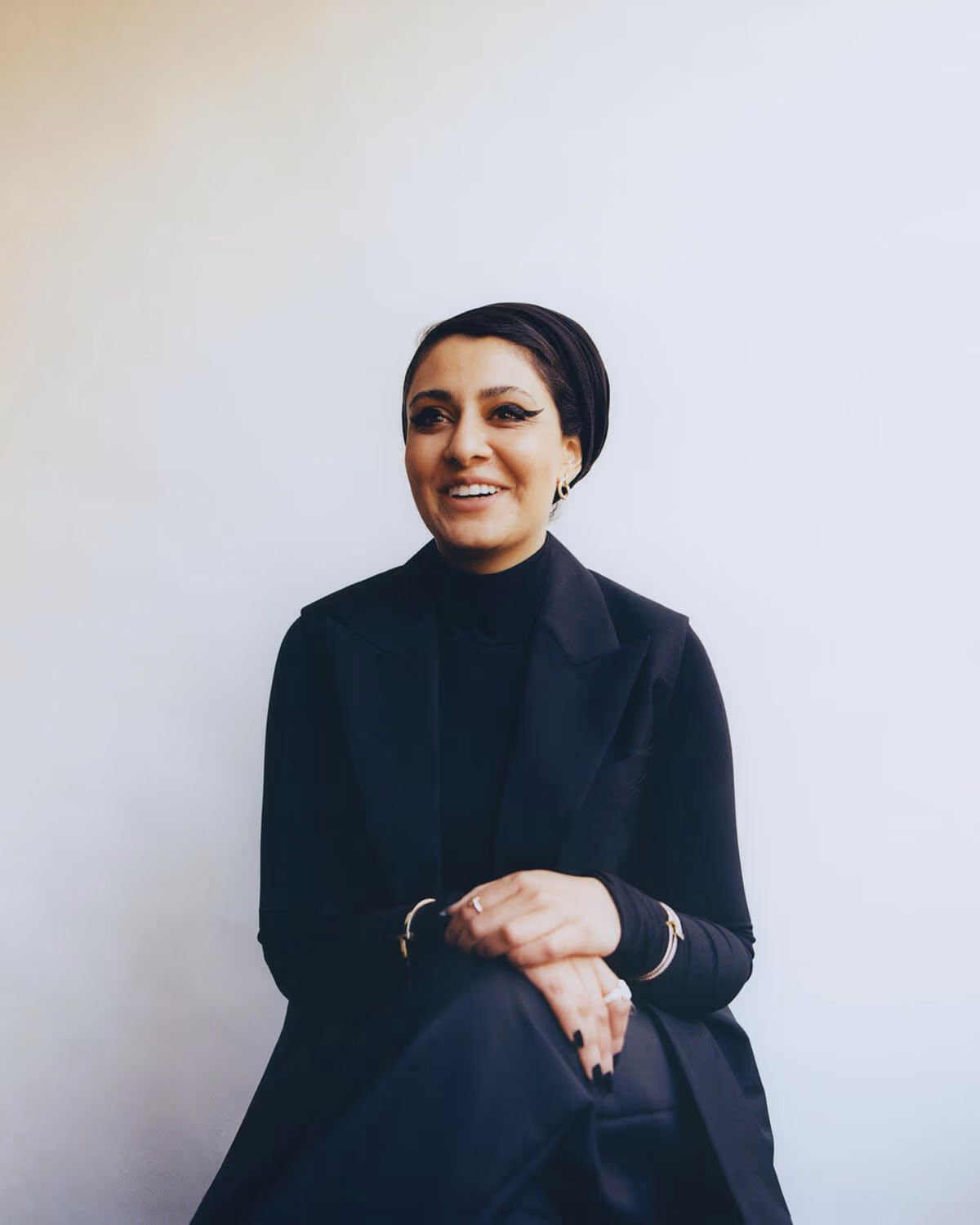 Sumayya wears full look by FENDI and jewelry by TIFFANY & CO.