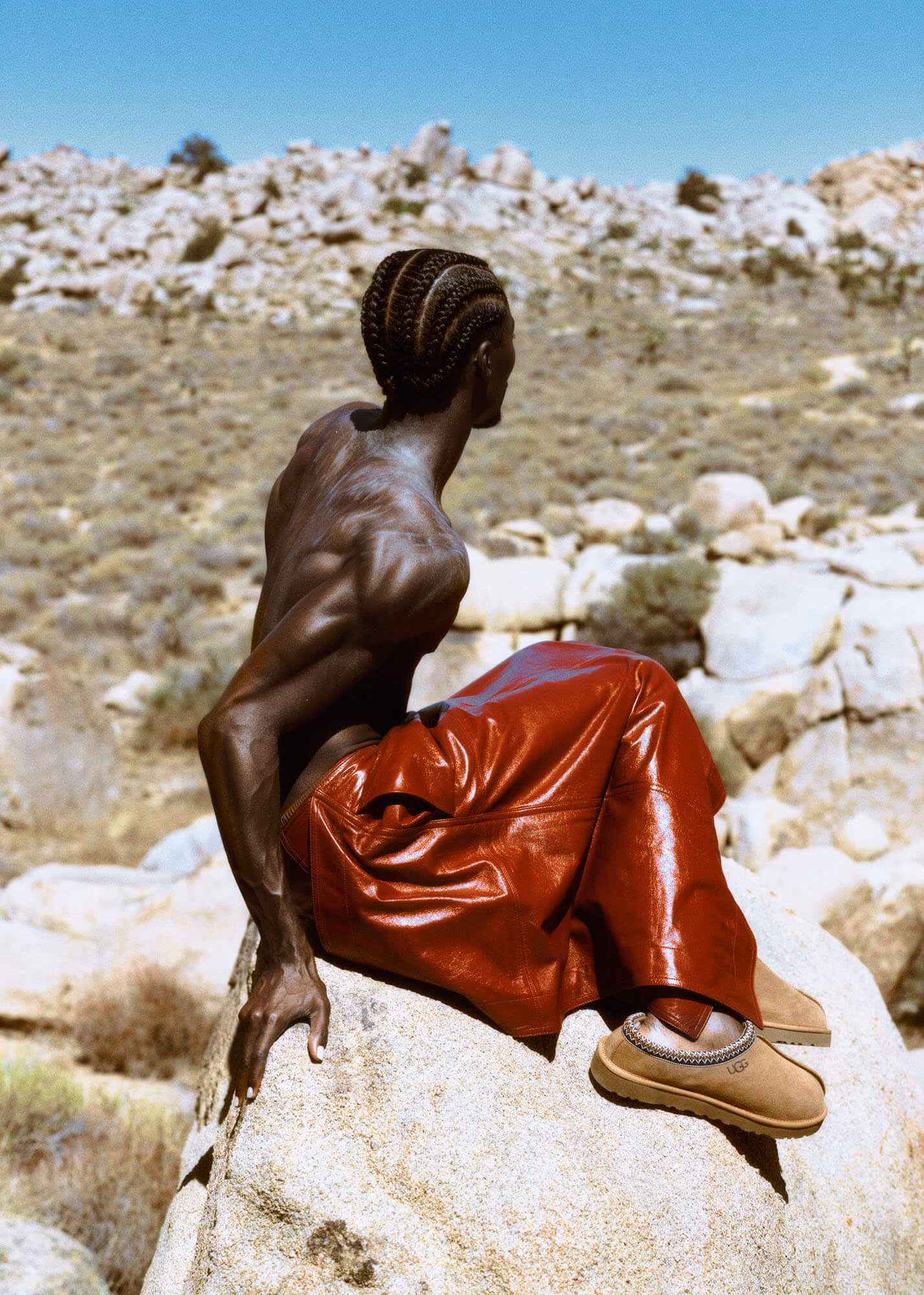 Alton wears skirt and pants by BOTTEGA VENETA.
