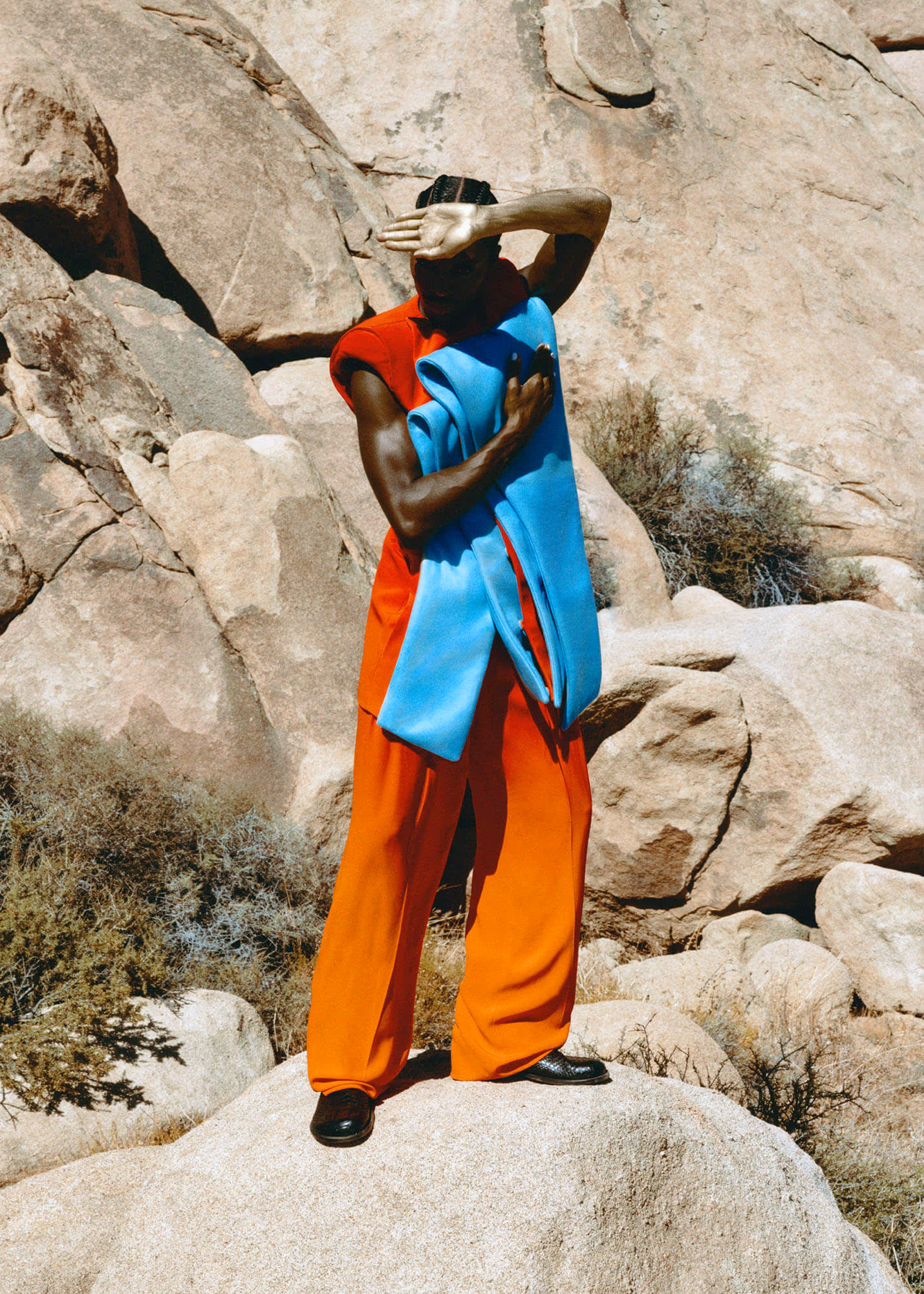 Alton wears vest and pants by BALMAIN and boots by LOEWE.