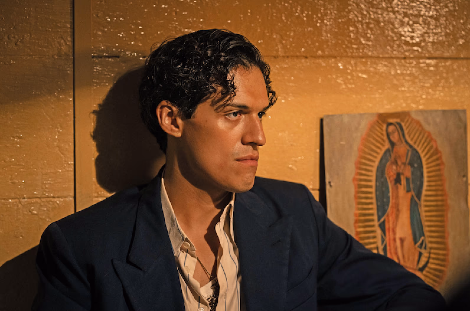 Omar Apollo in Luca Guadagnino’s Queer (2024). Photography by Yannis Drakoulidis. Image courtesy of A24.