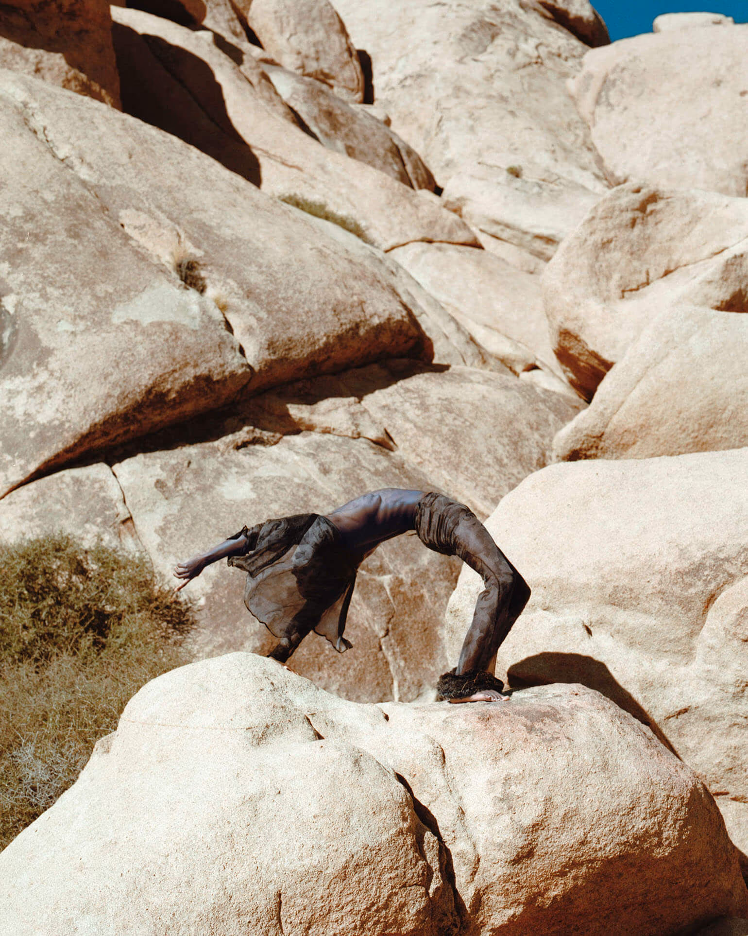 Alton Mason wears shirt and pants by ETRO.