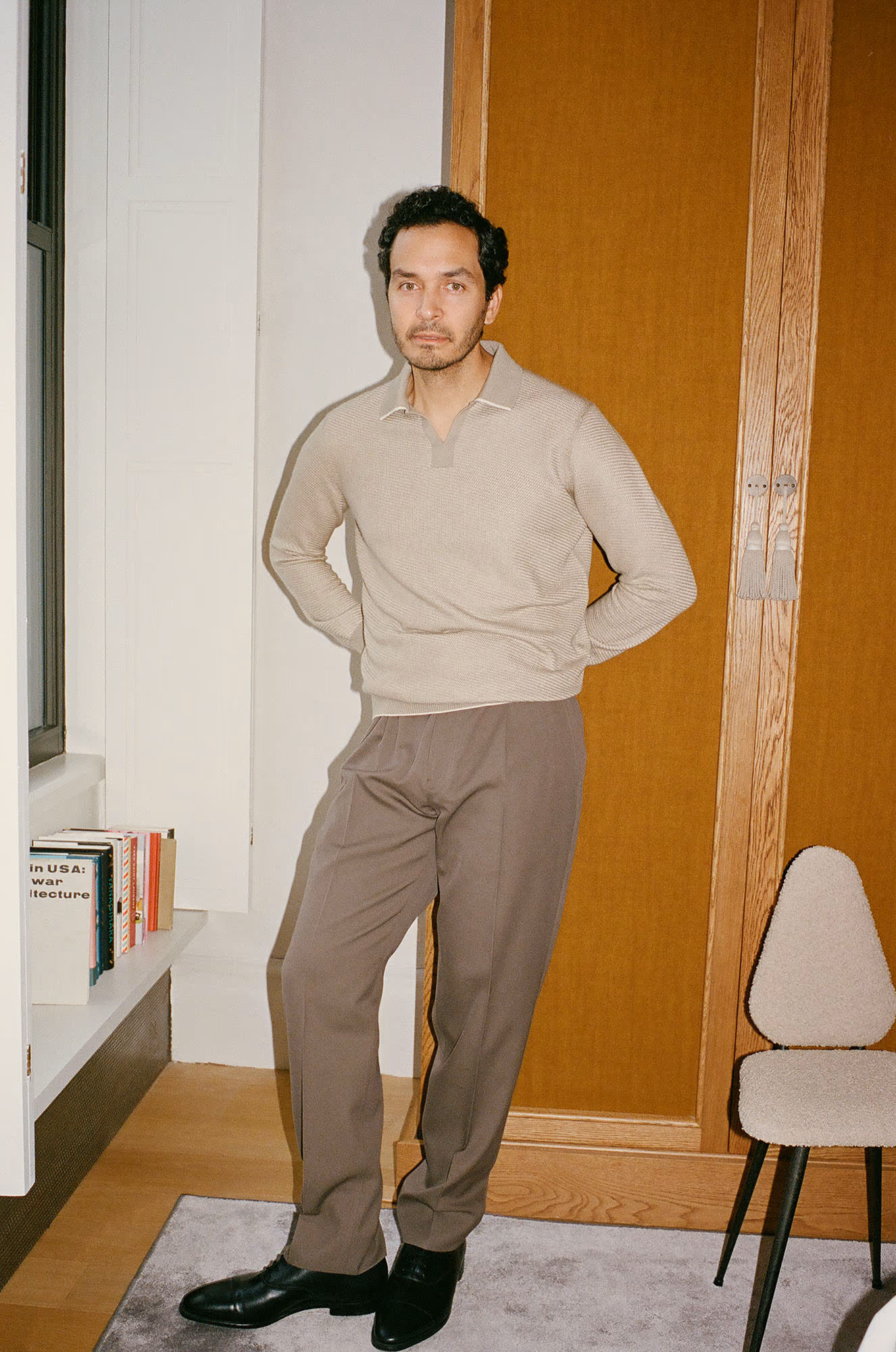Giancarlo wears sweater and pants by ZEGNA