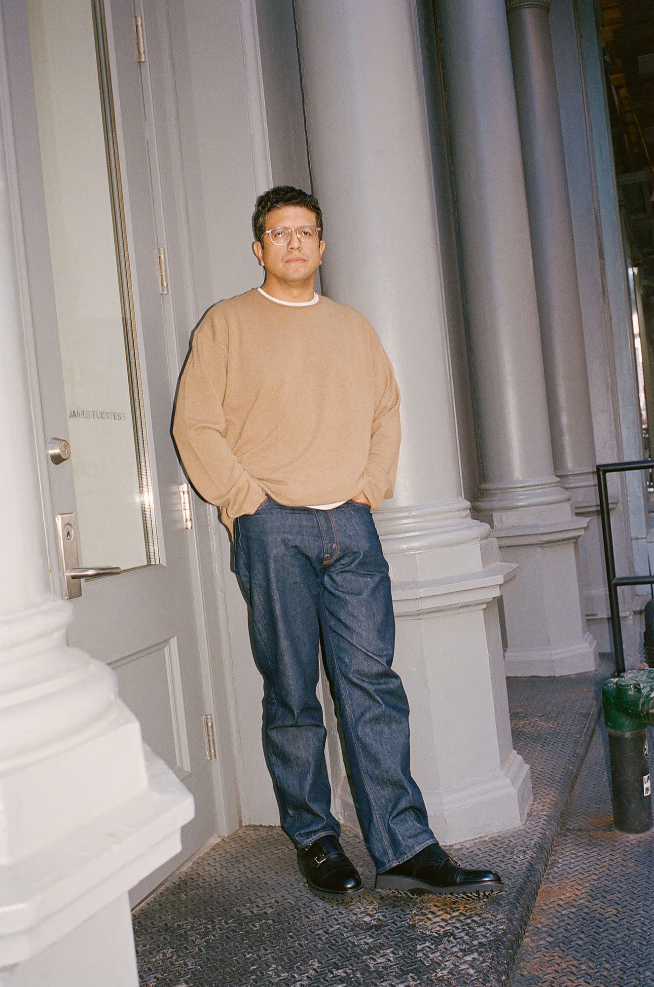 James Fuentes wears sweater by GUEST IN RESIDENCE and shoes by JOHN LOBB.
