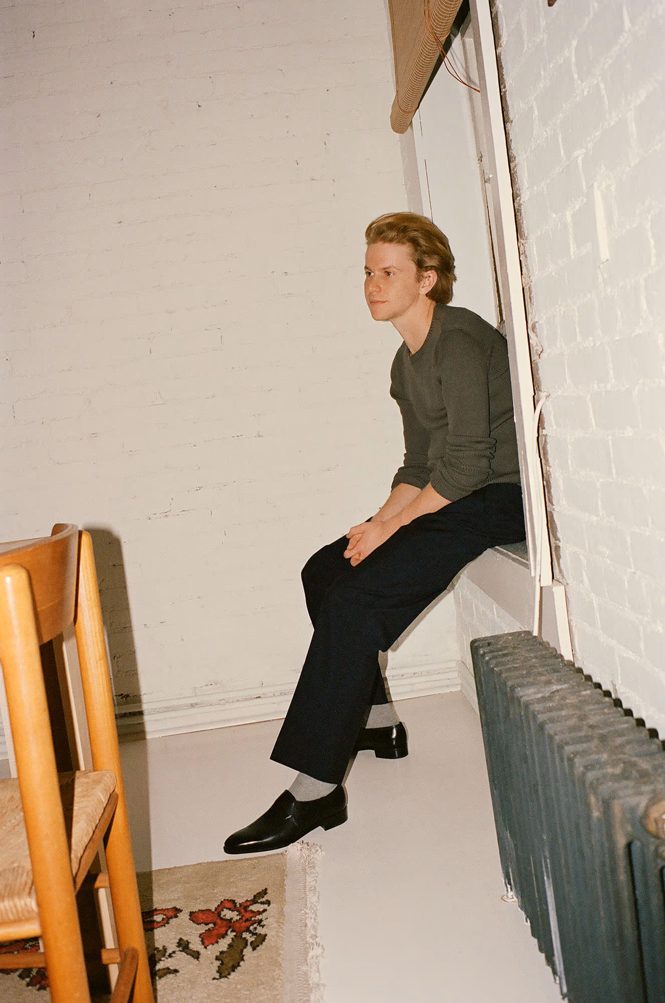 Flynn McGarry wears sweater by OUR LEGACY