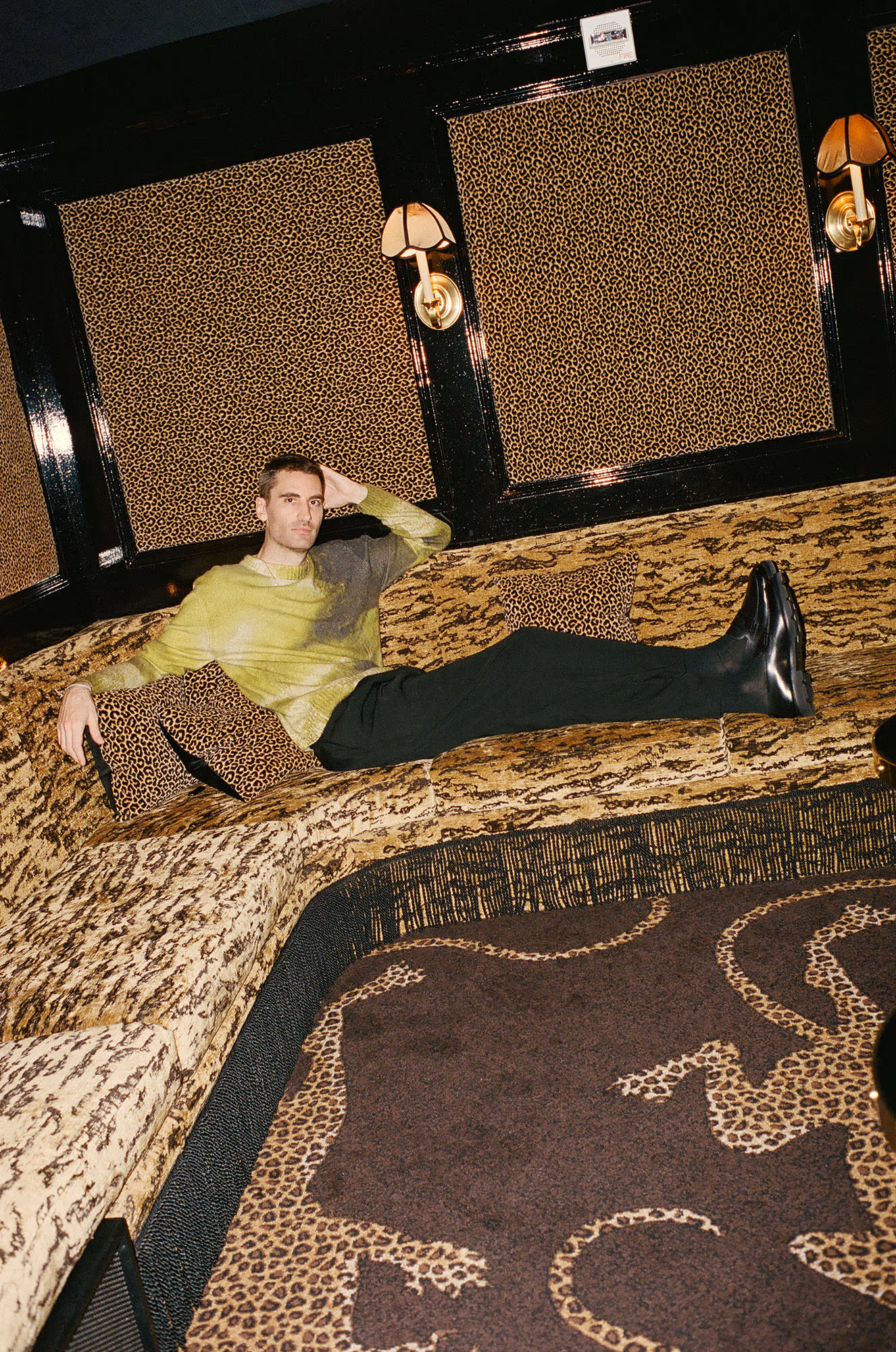 Kyle Hotchkiss Carone wears sweater by HERMÈS
