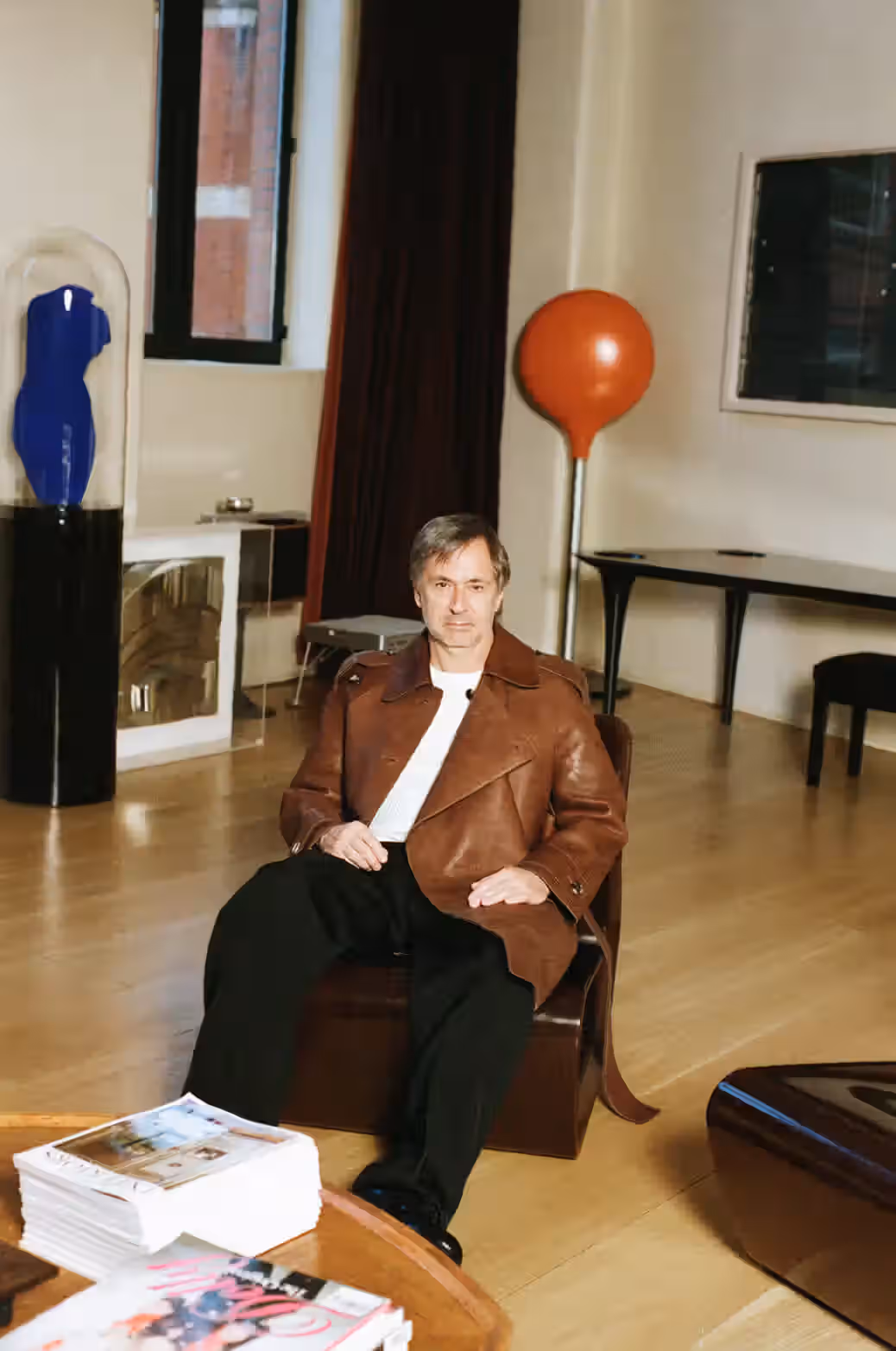 Marc Newson sits on Micarta chair by Marc Newson