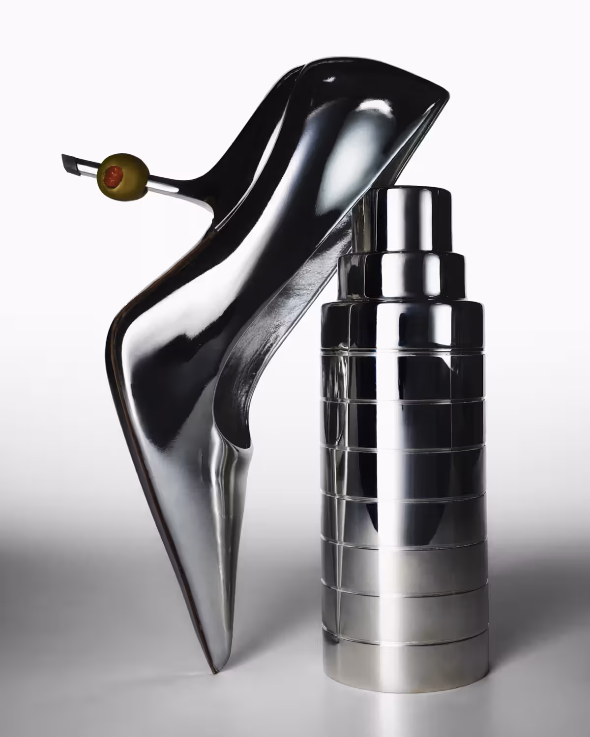 Shoe by FERRAGAMO and cocktail shaker by RALPH LAUREN.