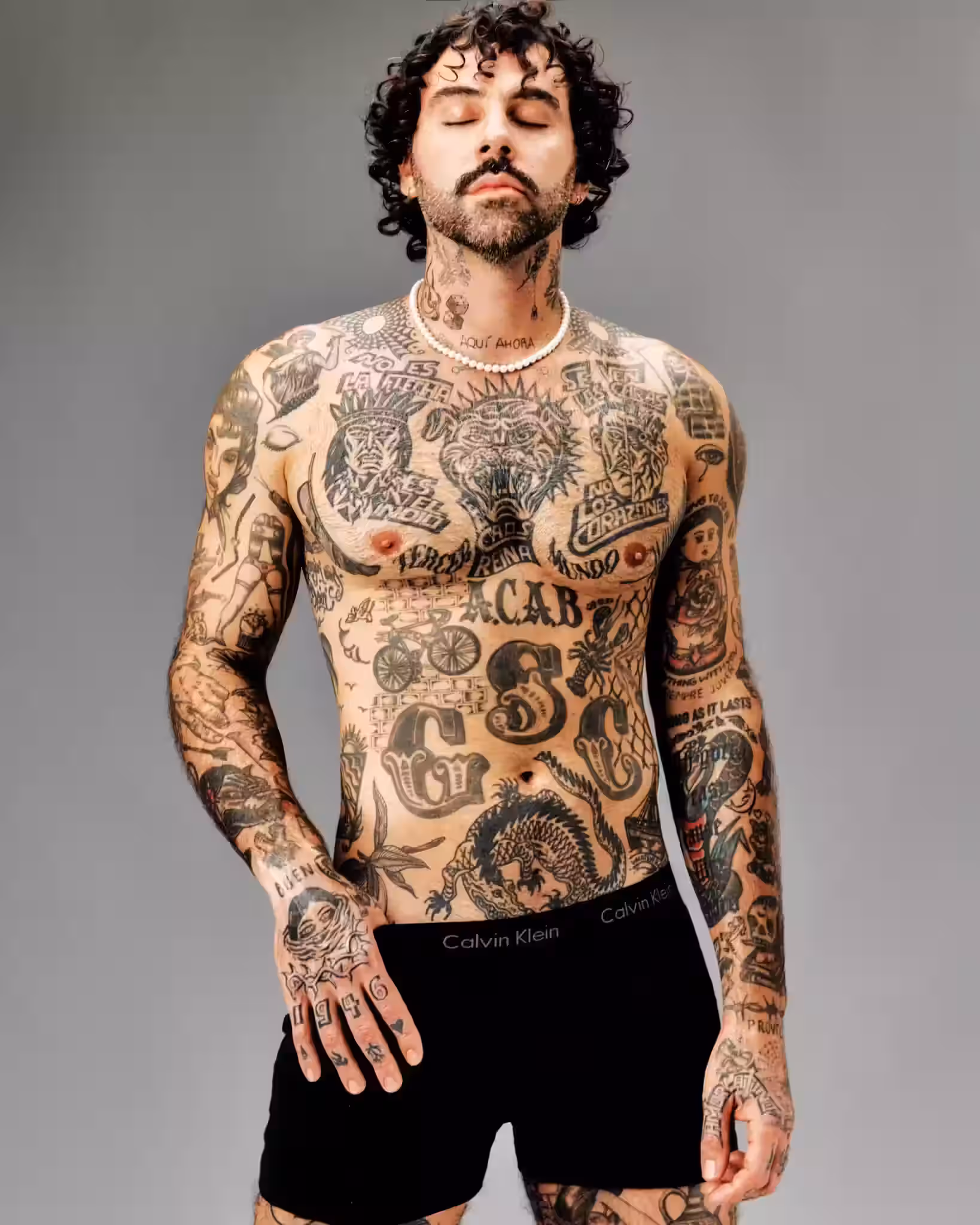 Luis wears his own pearls and boxers by CAVLIN KLEIN.