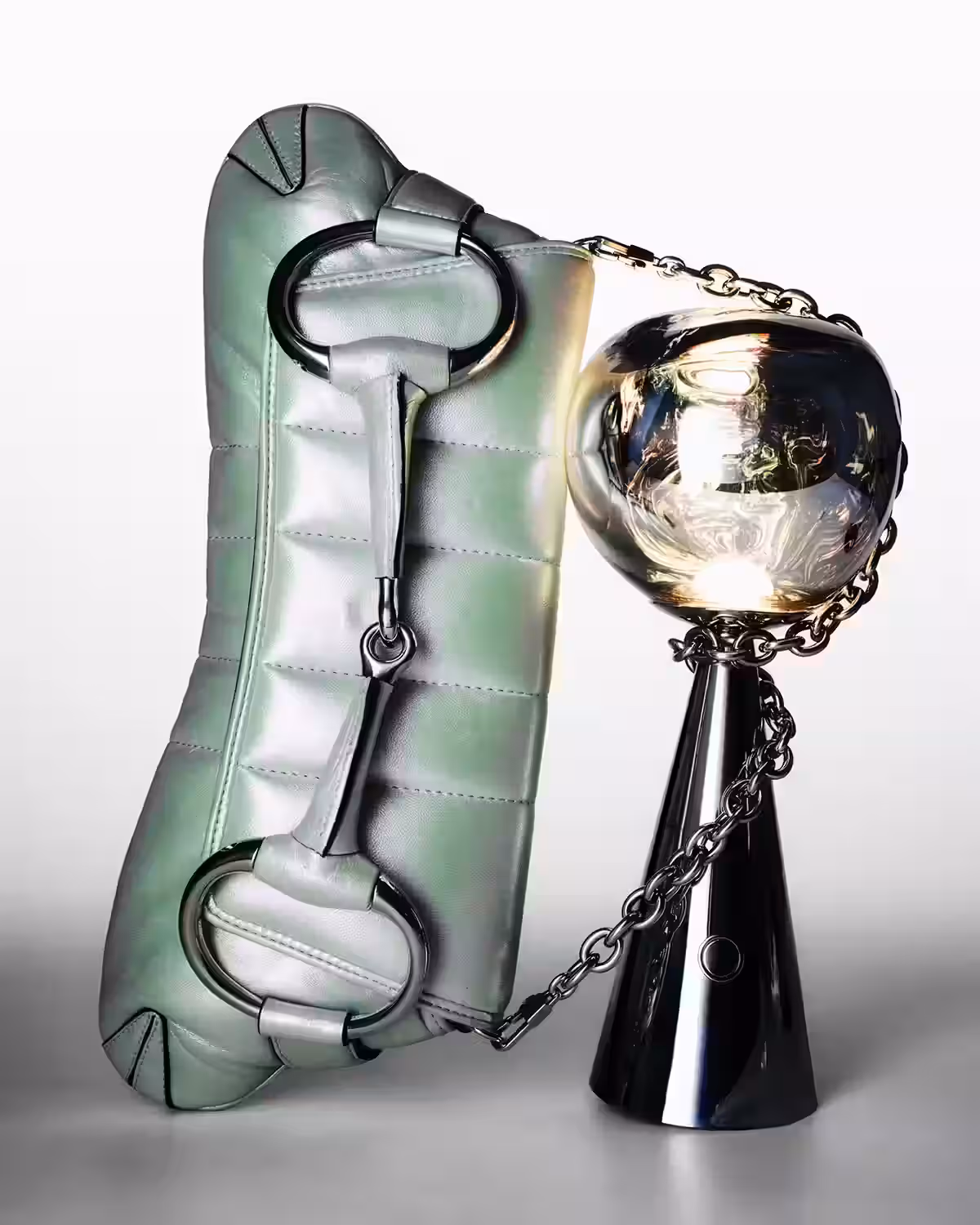 Bag by GUCCI and lamp by TOM DIXON.