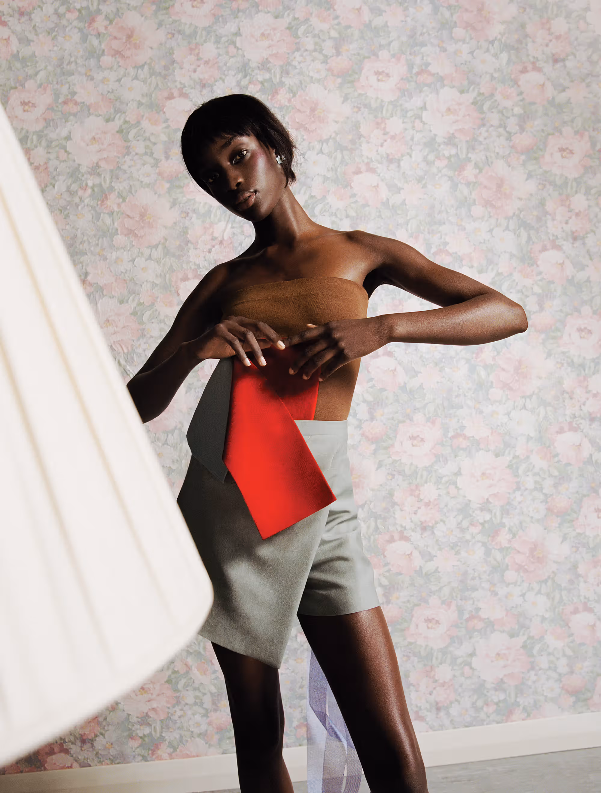 Maty wears top and shorts by FENDI and earrings by ALEXIS BITTAR.