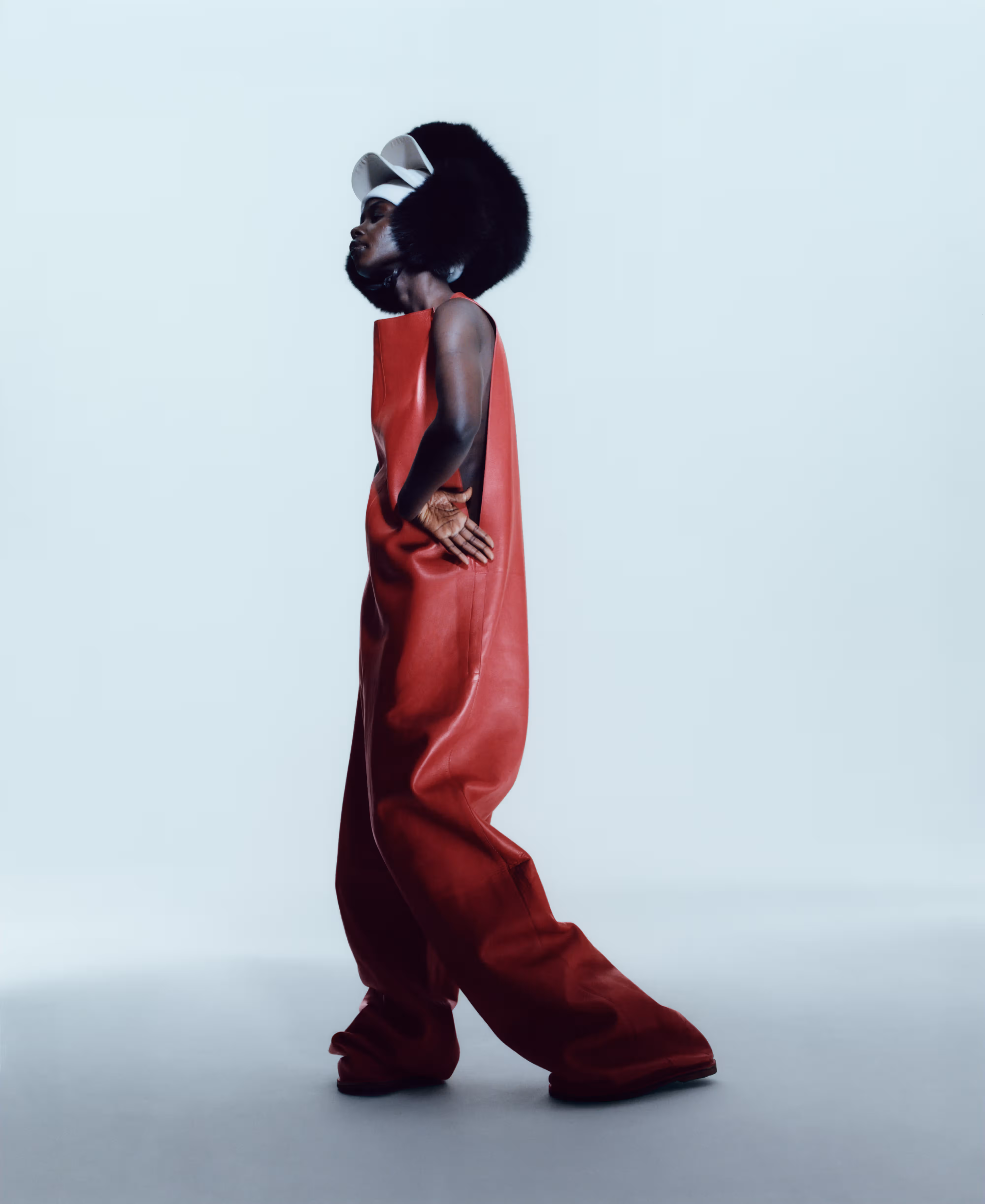 Aweng wears jumpsuit by LOEWE and stylist’s own hats.