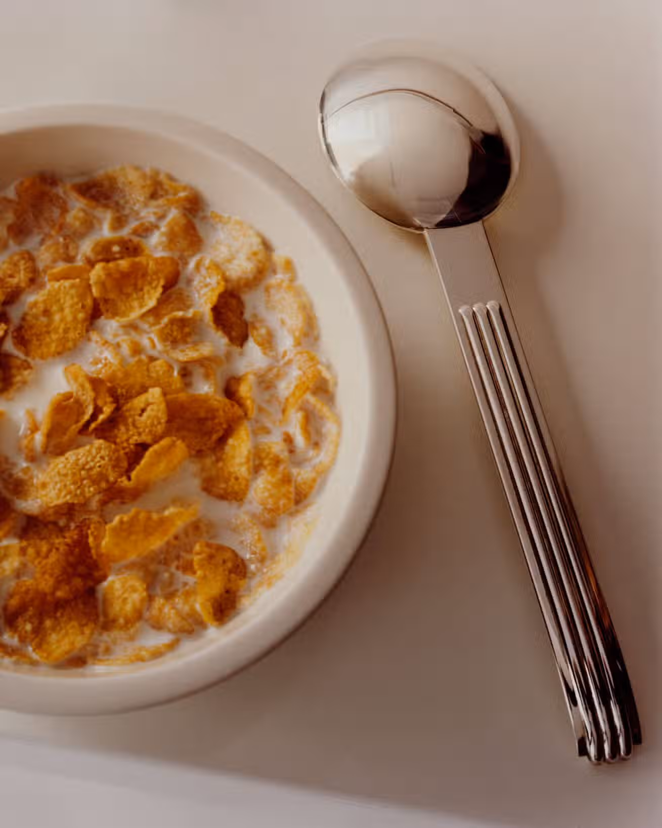 Bowl from LA TRÉSORERIE and spoon by PUIFORCAT