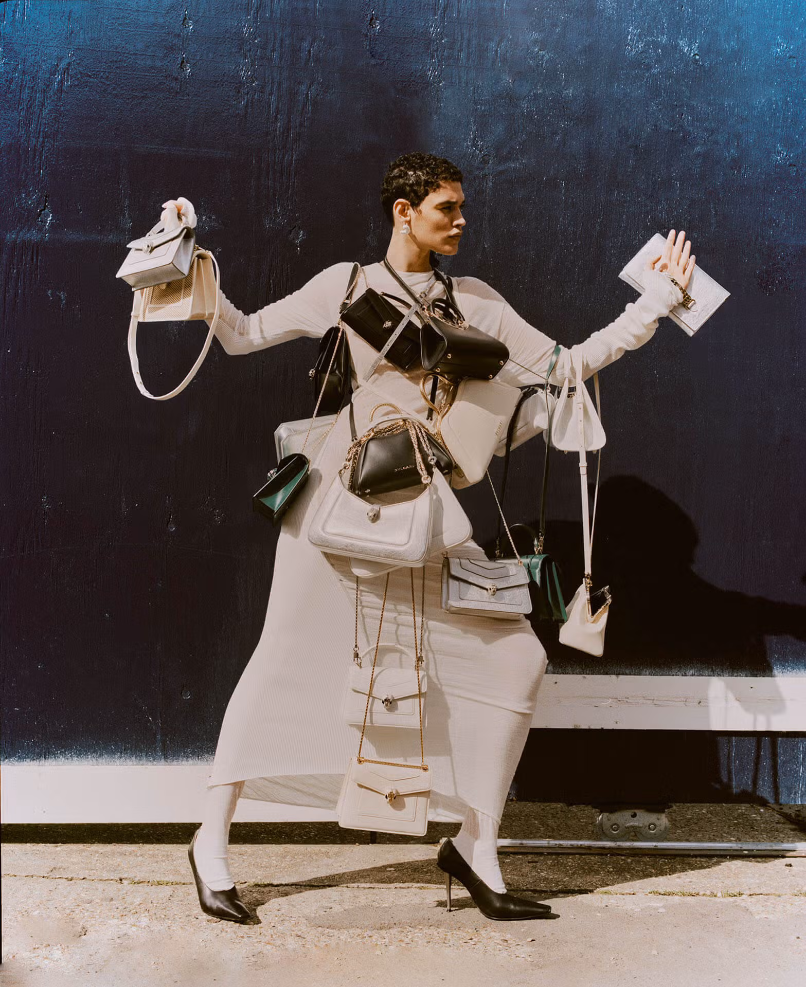 Kerolyn wears bags by BULGARI