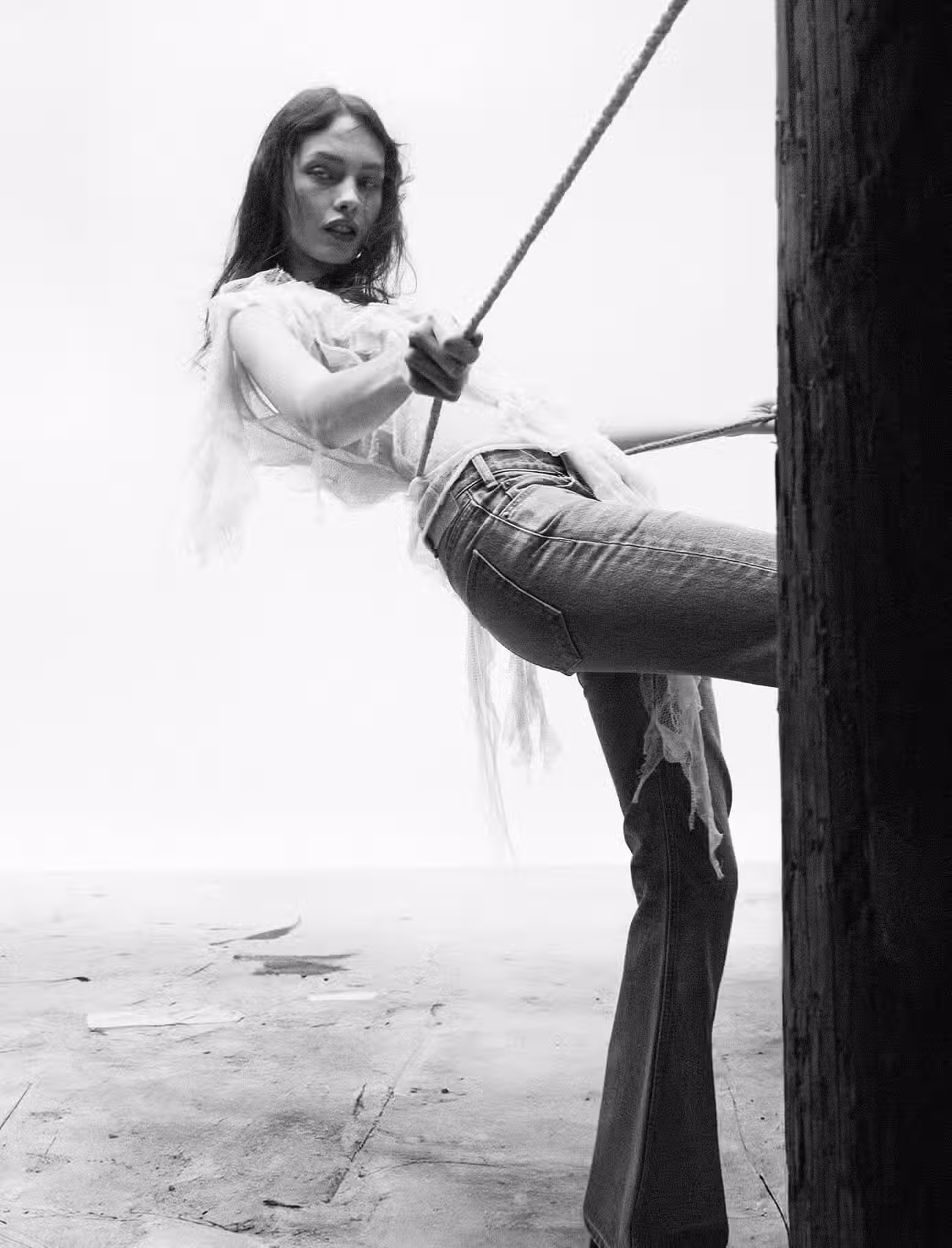 Clara wears top by CHRISTIAN DIOR and jeans by CELINE.
