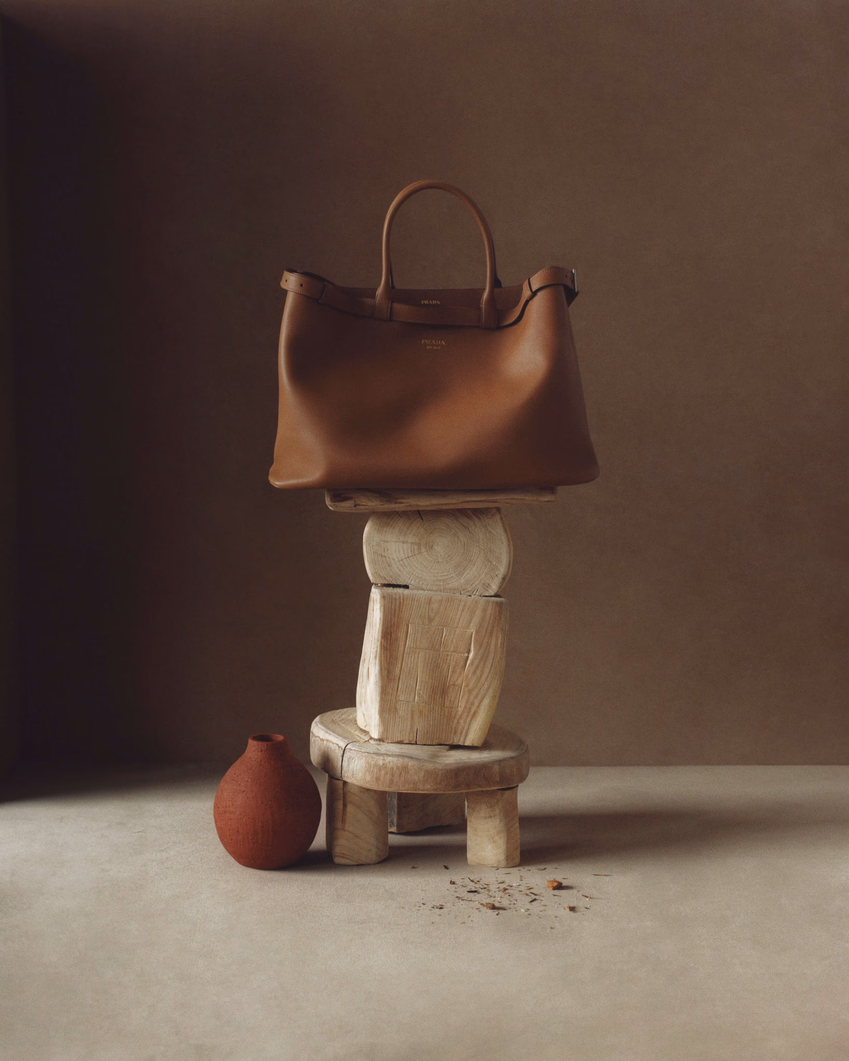 Bag by PRADA. Chair by CHRISTOPHER AL-JUMAH.