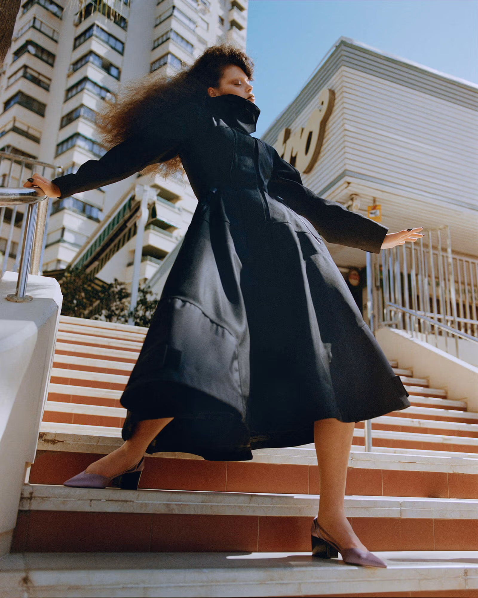 Isla wears full look by PRADA.