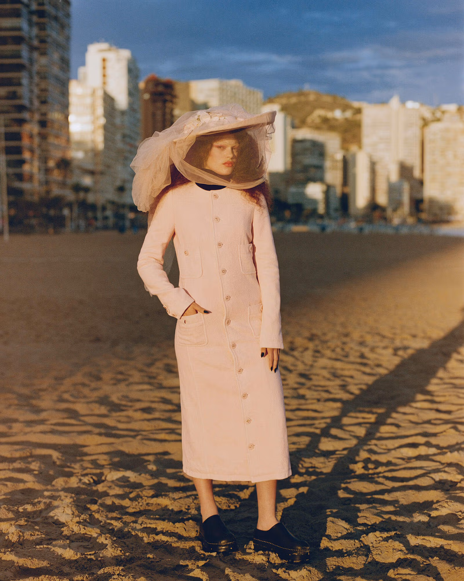 Isla wears dress by COACH