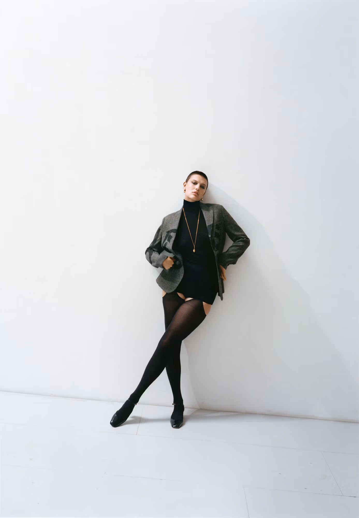 Celina wears full look by CHRISTIAN DIOR.