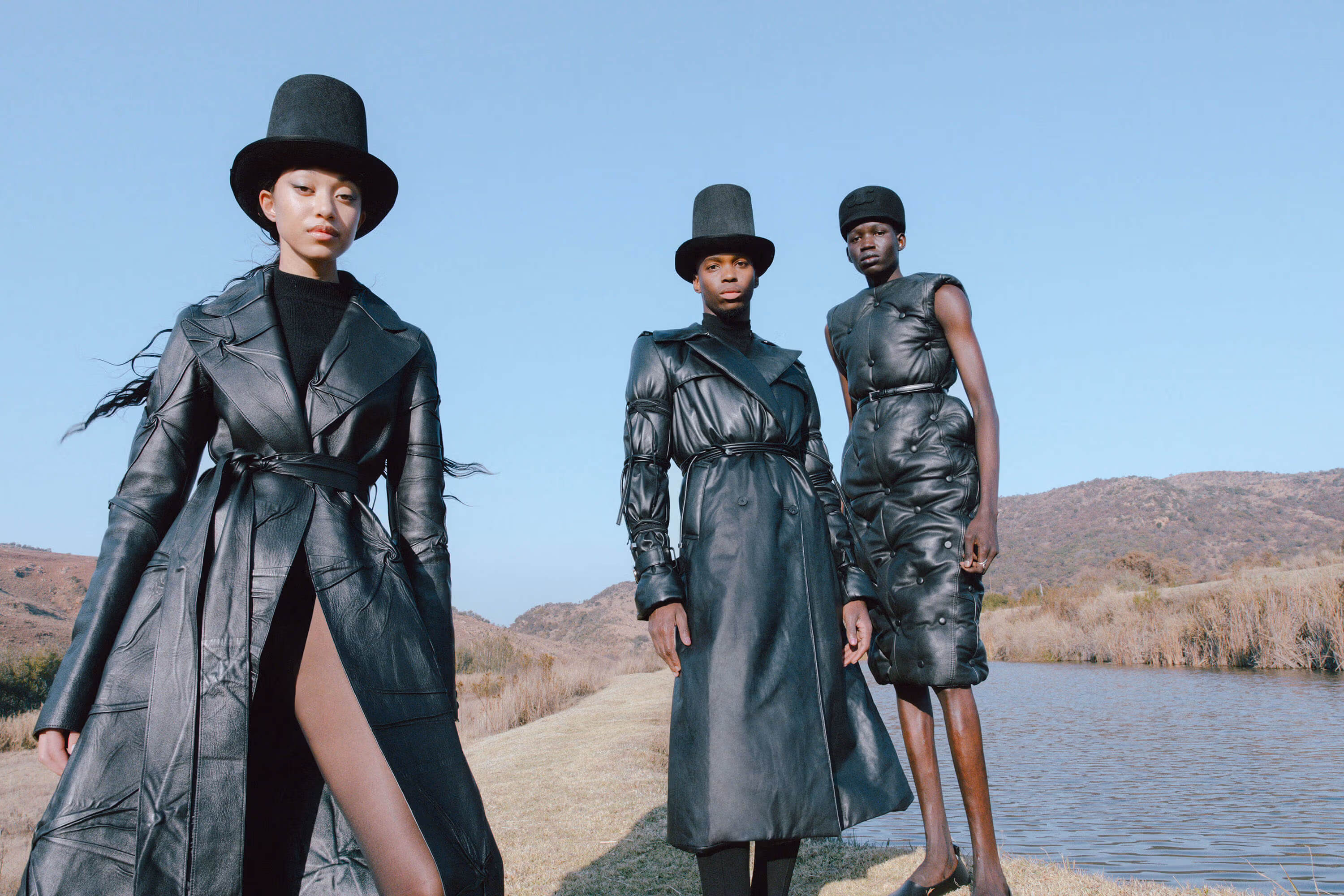 Domonique Evans wears full look by GABRIELA HEARST and tights by FALKE. Lebohang Otukile wears full look by ALEXANDER MCQUEEN. Nelson Maker wears dress by HODAKOVA