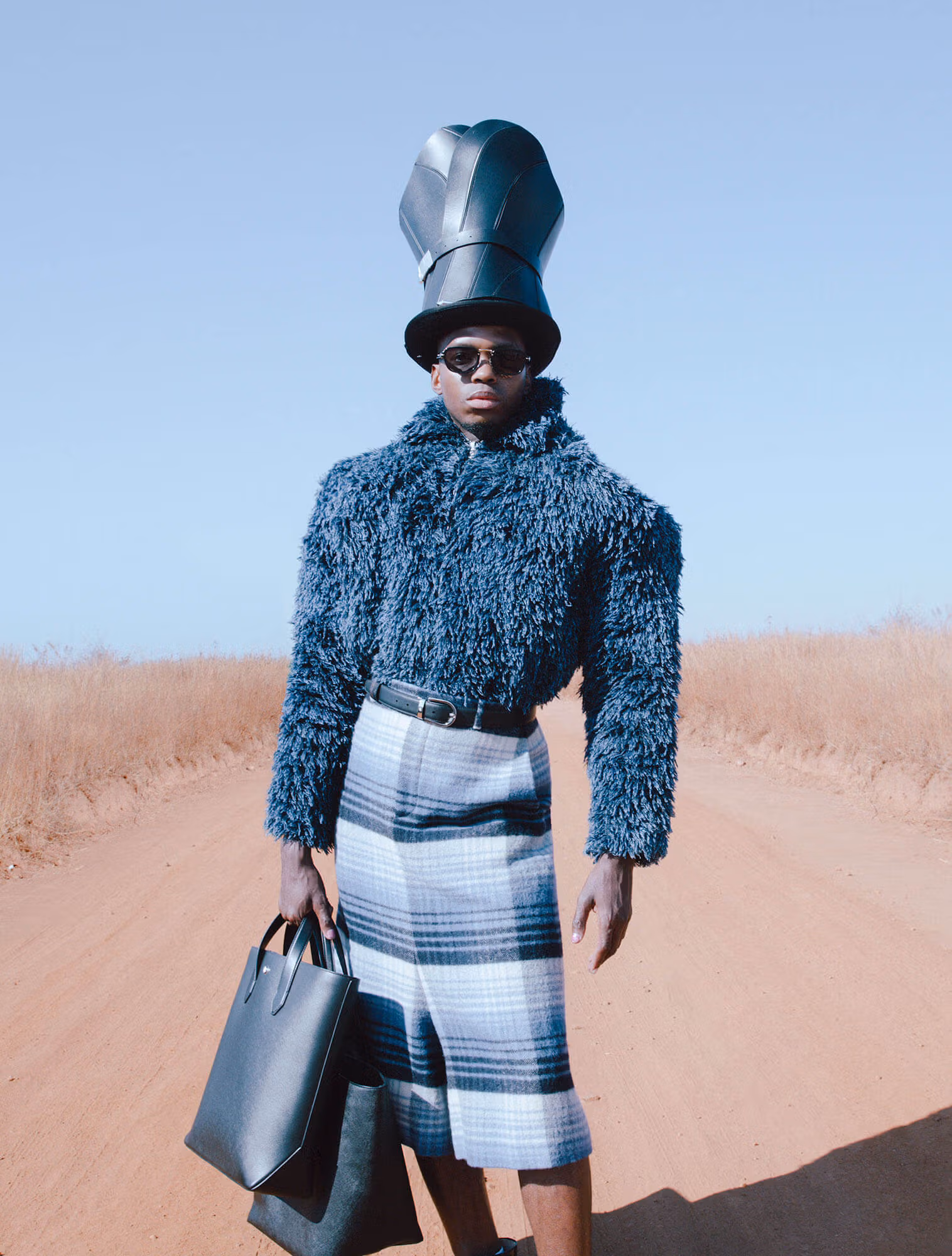 Lebohang wears sweater and shorts by FENDI