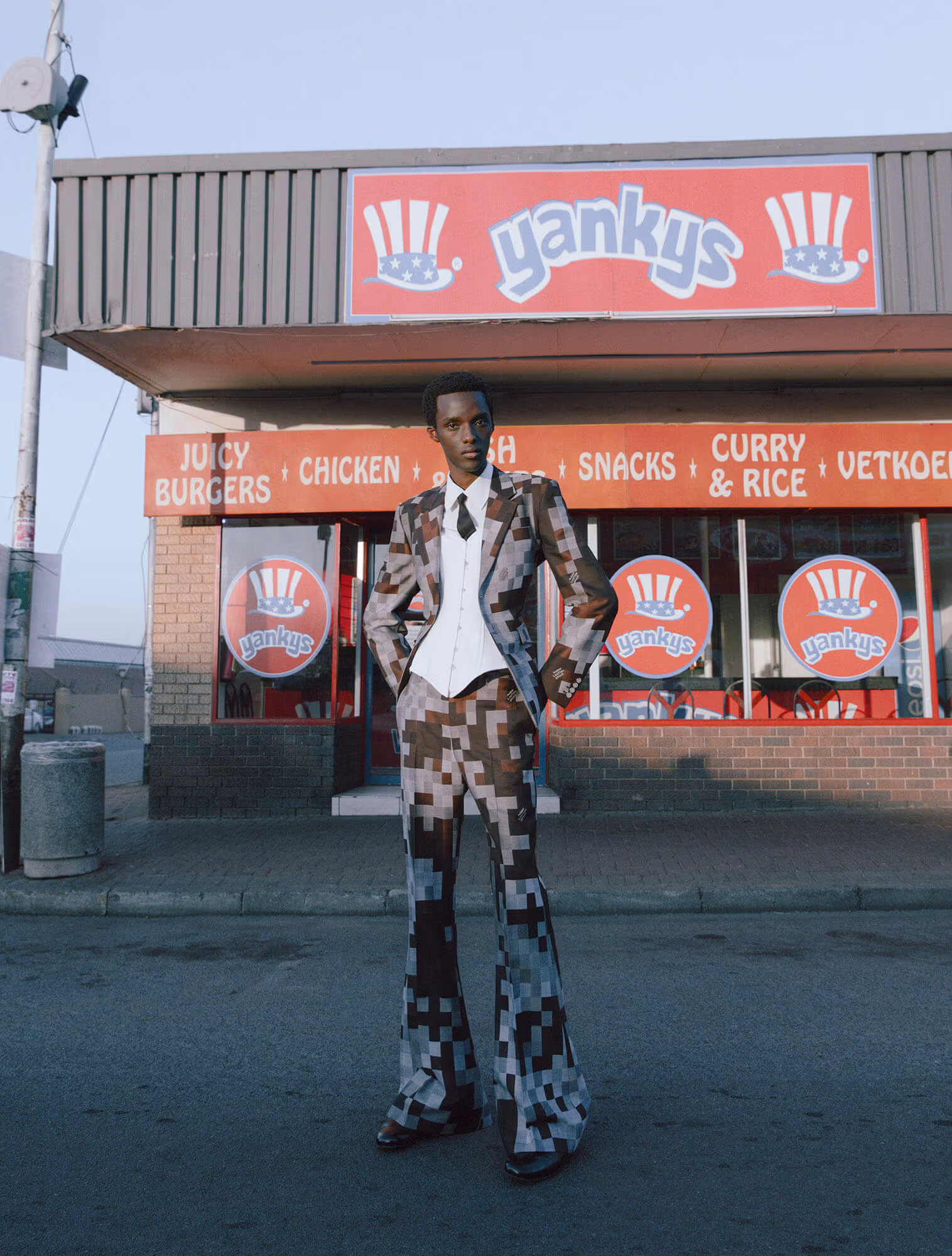 Aphile Carter wears full look by LOUIS VUITTON and shoes by PRADA.