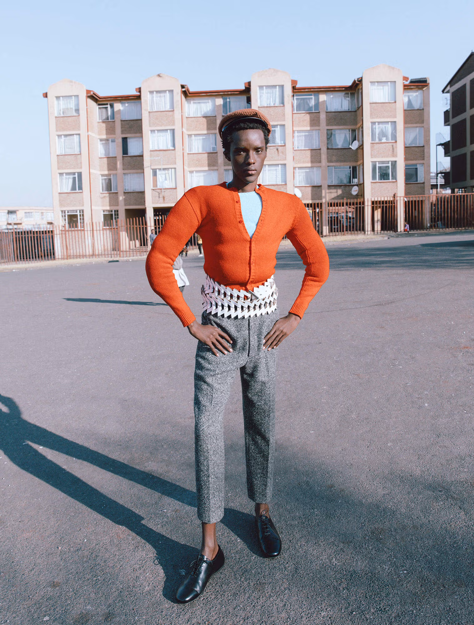 Aphile wears full look by PRADA.