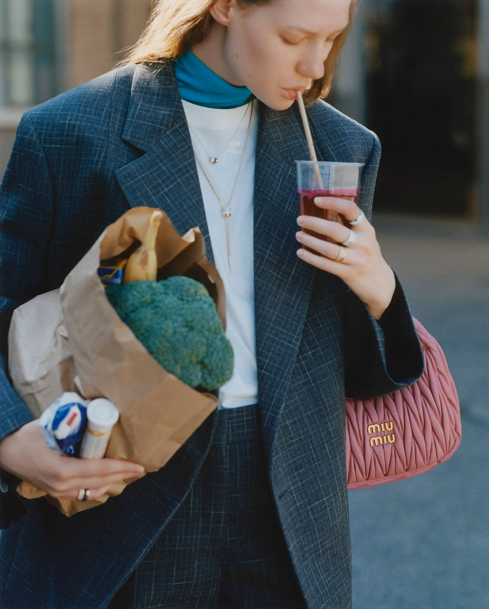 Olga Lane wears suit by JIL SANDER
