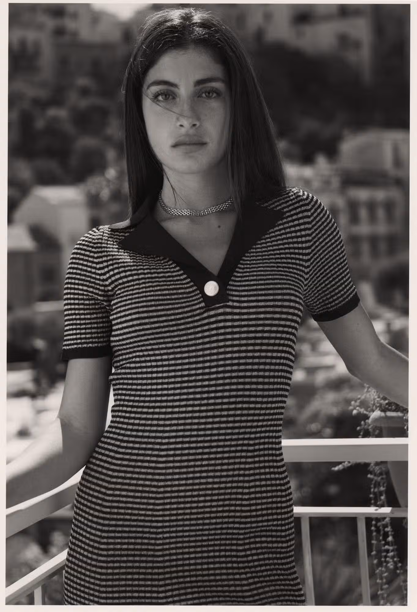 Asia wears dress by TOMMY HILFIGER.