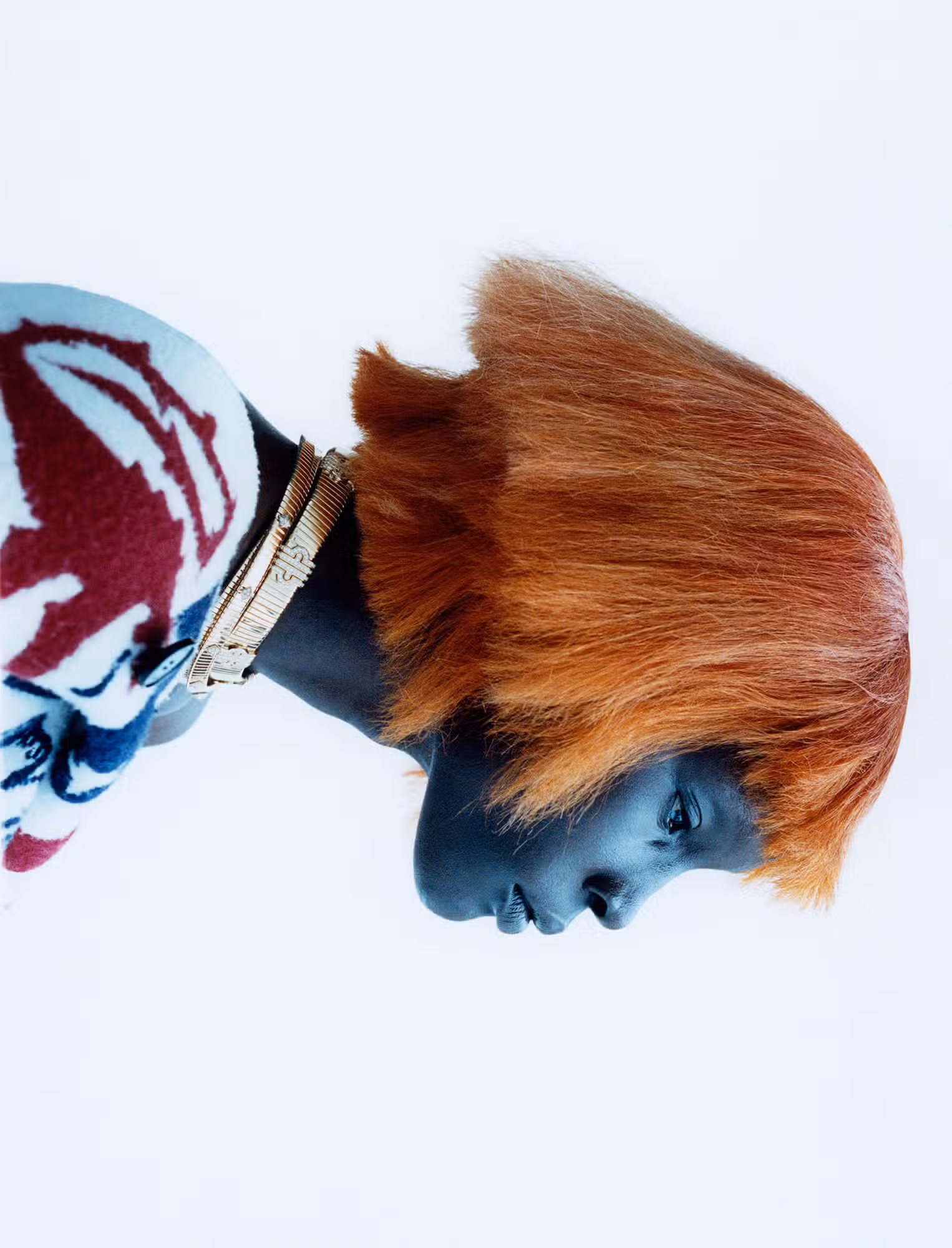 Atem wears cape by DIOR and necklaces by BVLGARI.