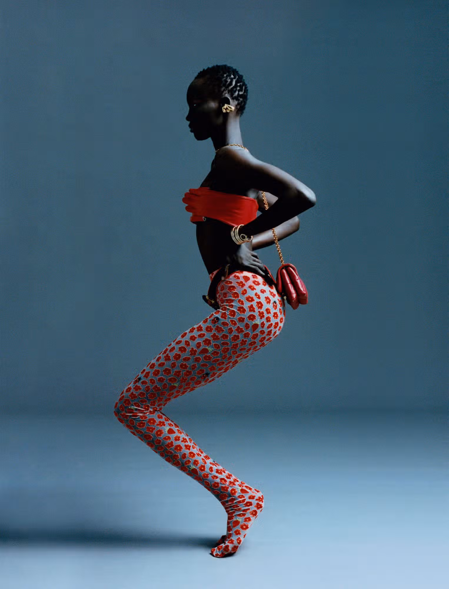 Atem wears tights and bag by VERSACE