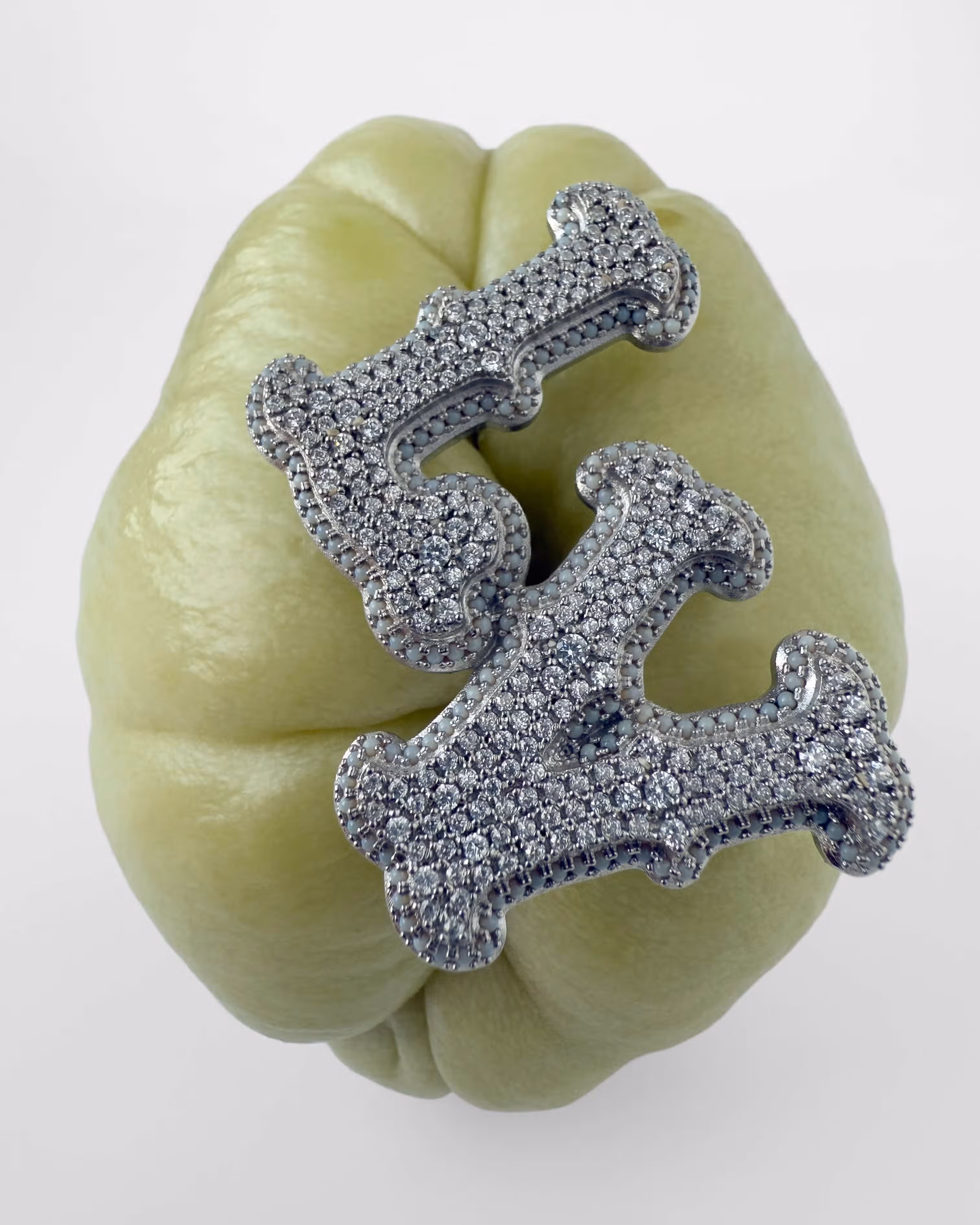 Brooch by LOUIS VUITTON.