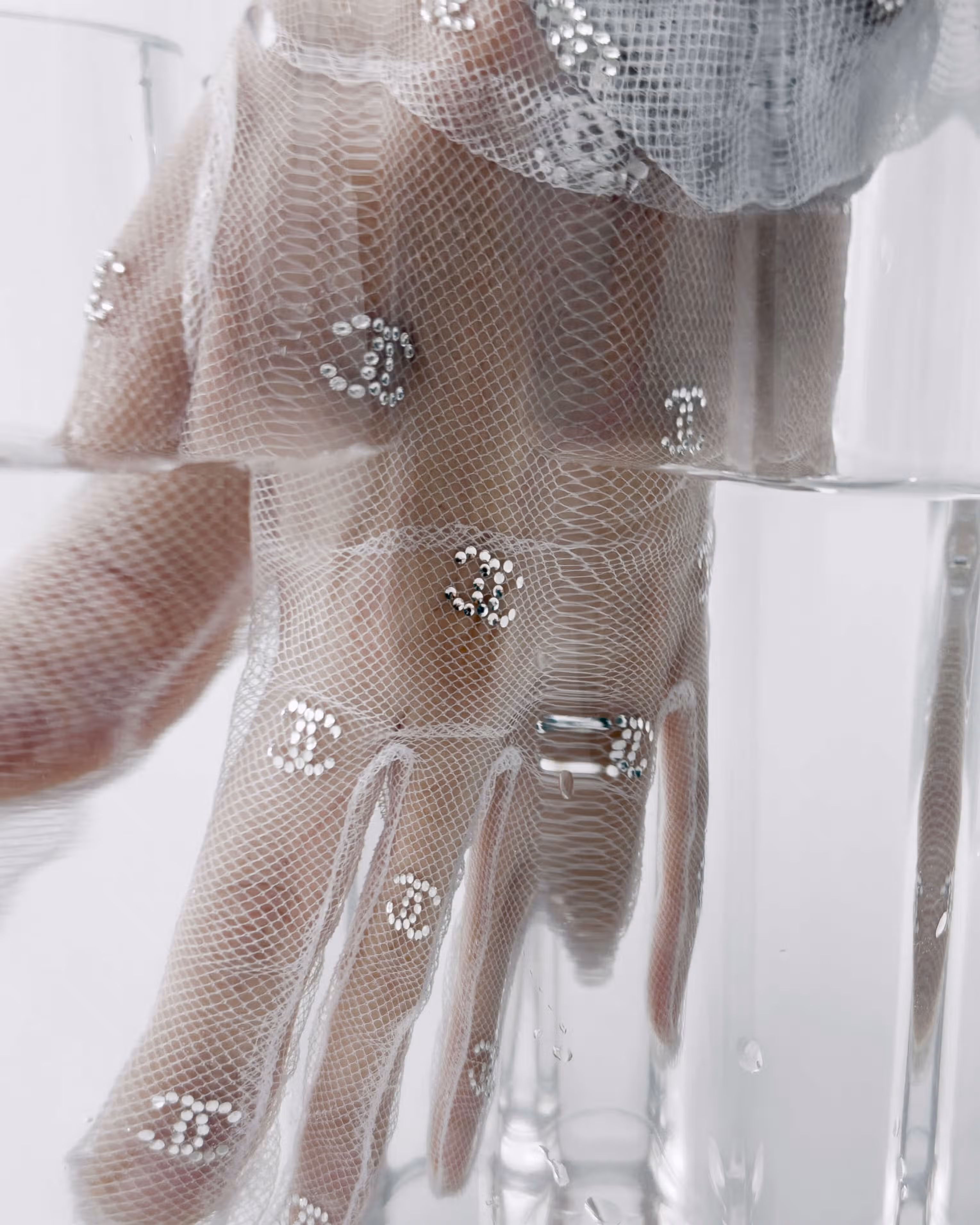 Glove by CHANEL.