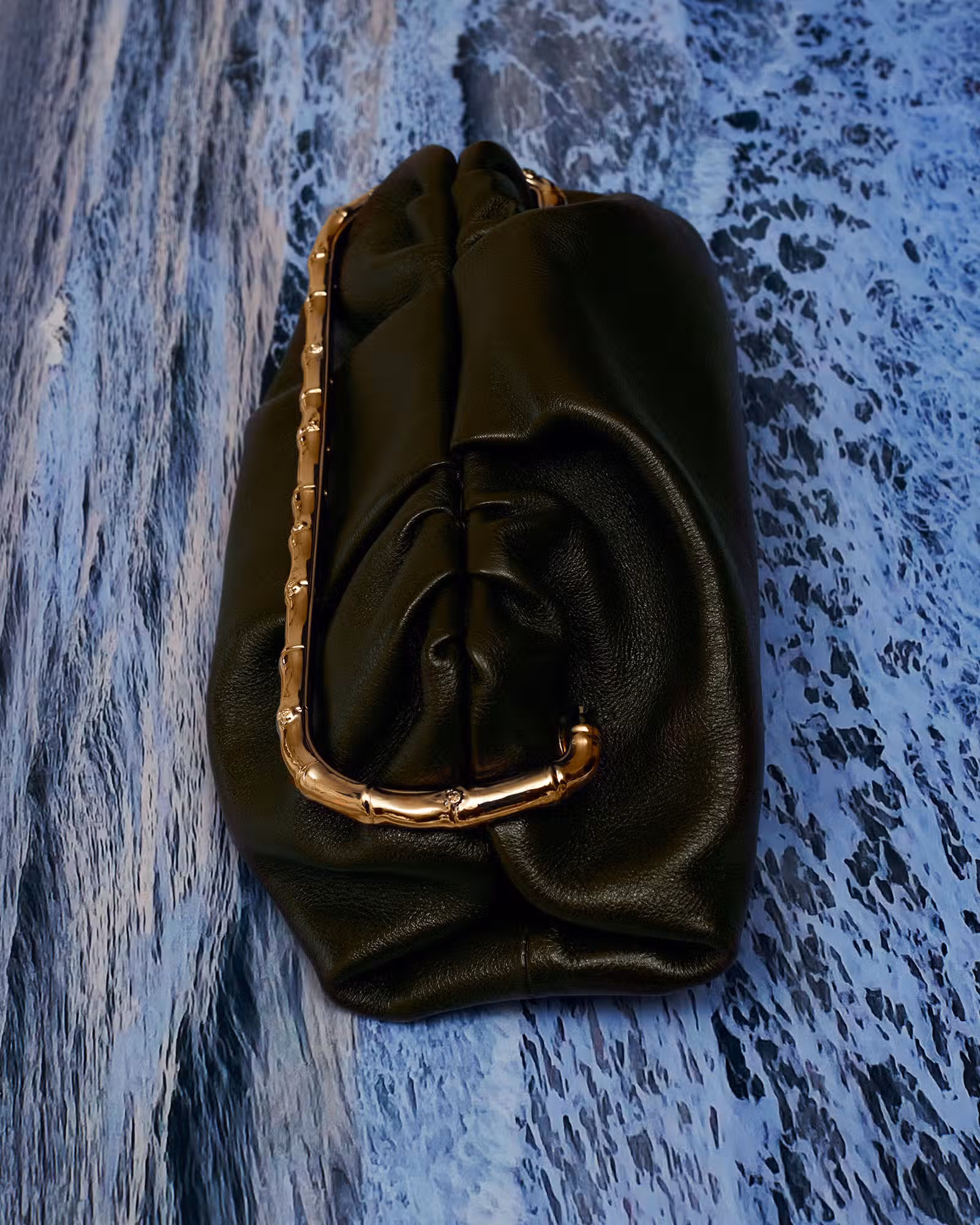Bag by GUCCI.