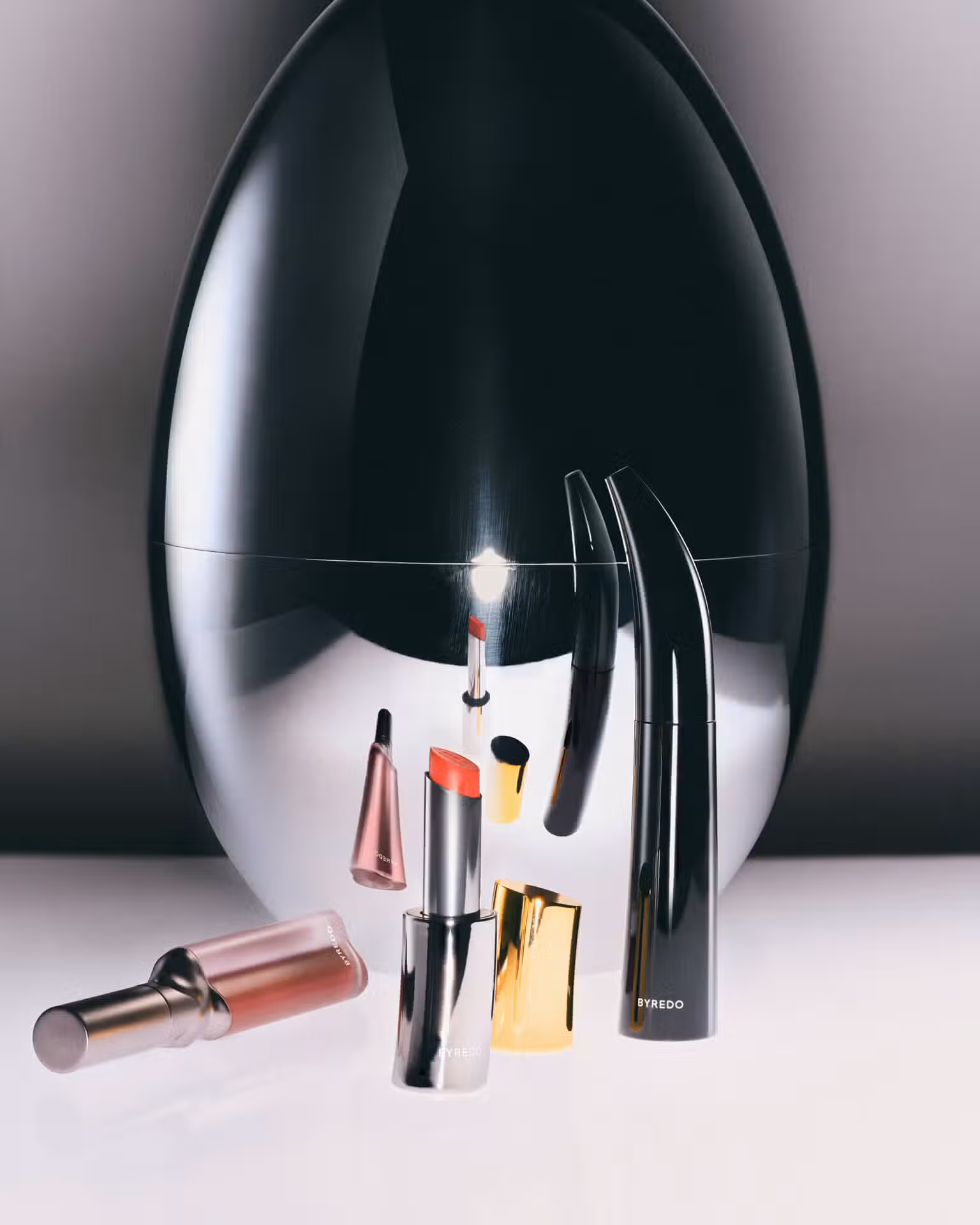 Lipsticks and mascara by BYREDO and flatware set by CHRISTOFLE.