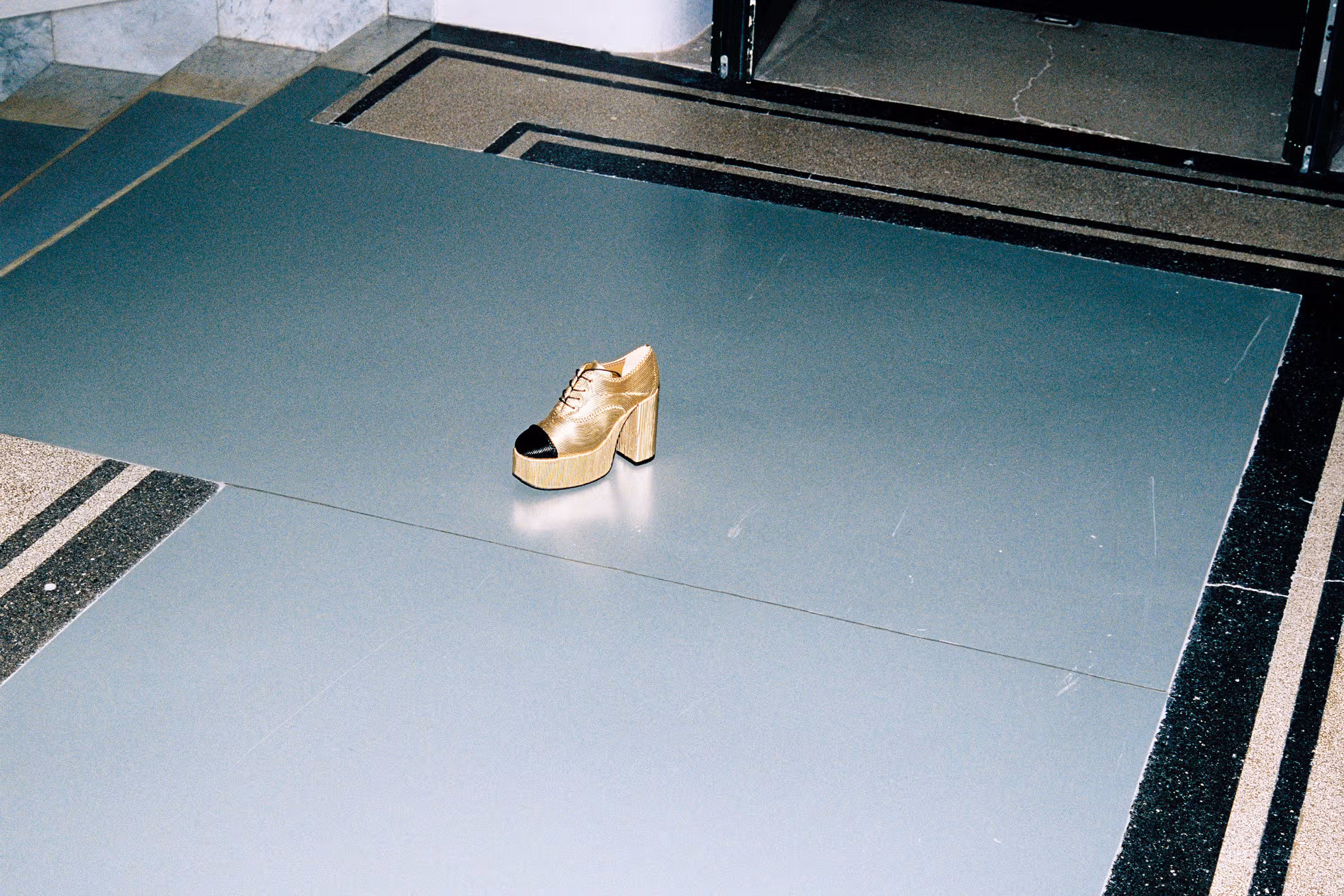 Shoe by CHANEL.