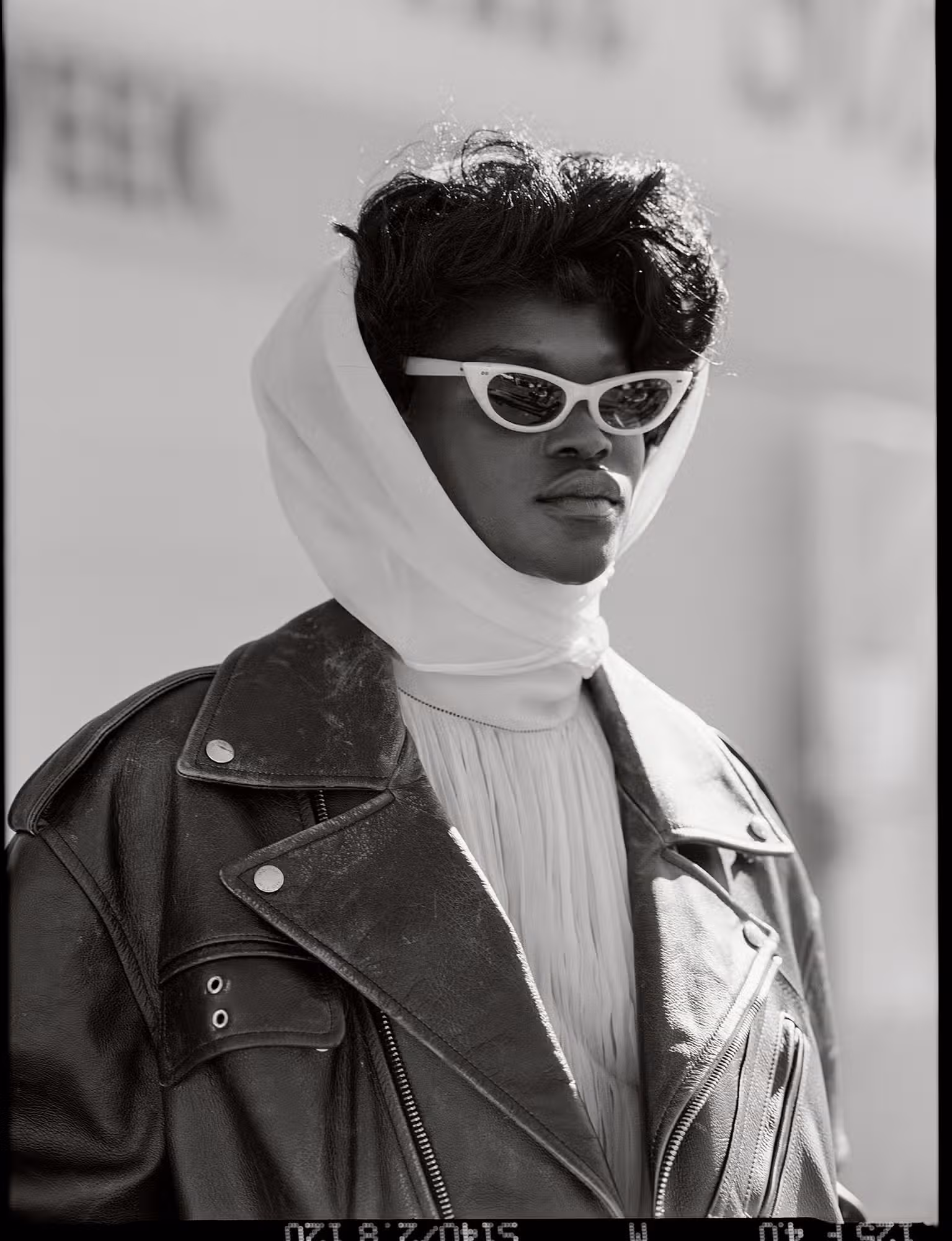 Awar wears jacket and top by ALEXANDER MCQUEEN.