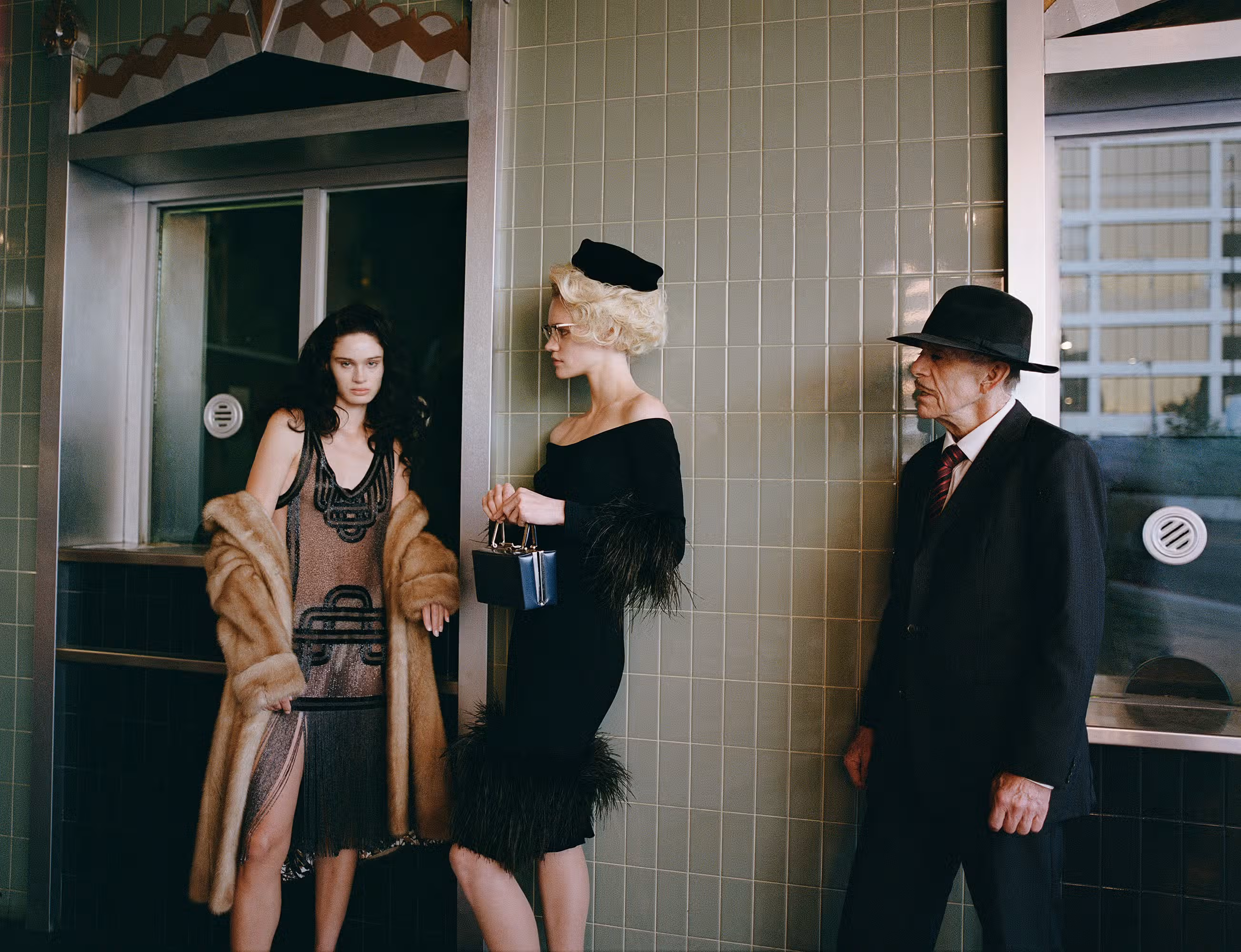Jeannie Pfeiffer wears dress by FENDI. Ksenia and Johnny wear vintage.