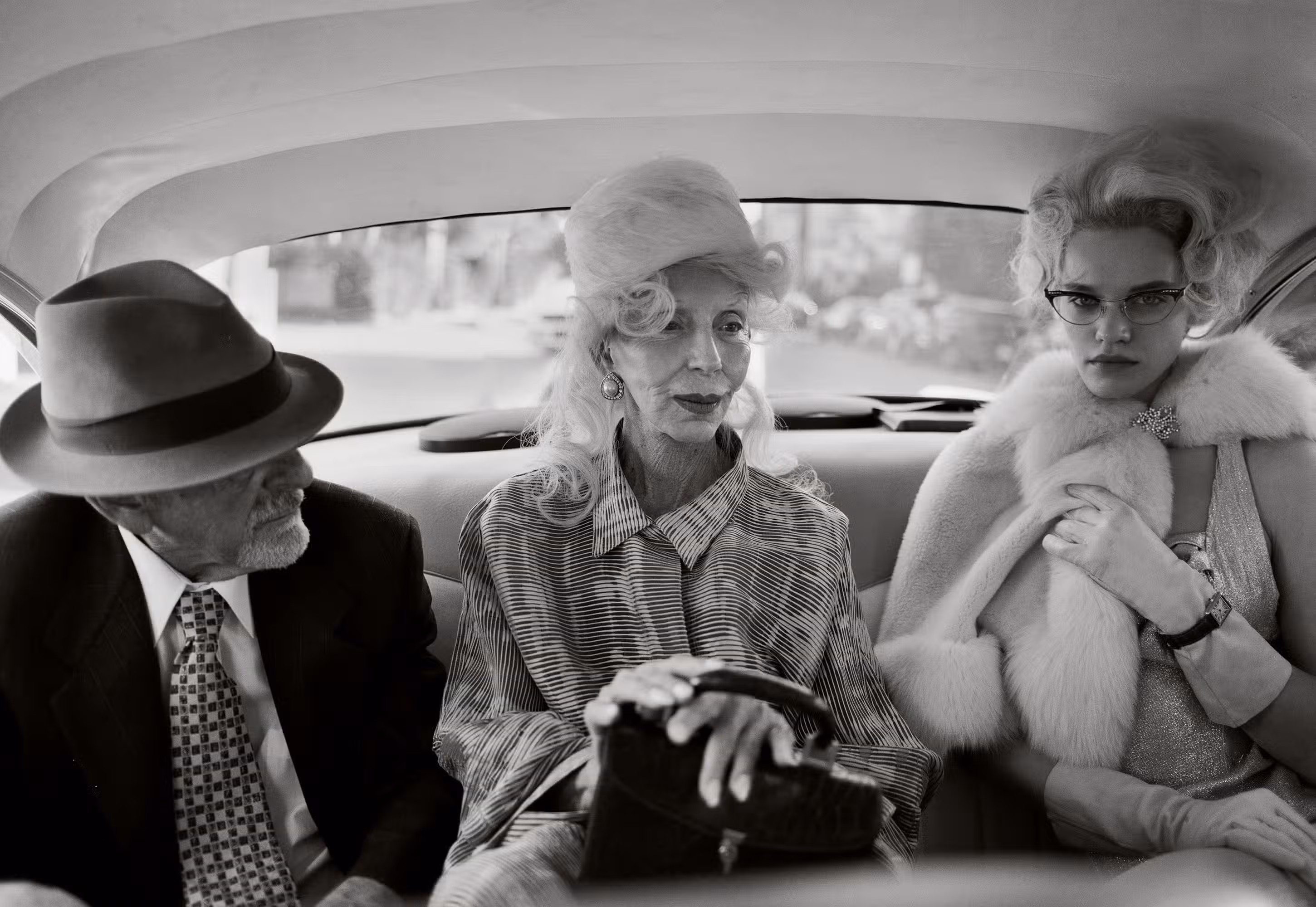 Johnny wears vintage. Colleen wears coat by GIORGIO ARMANI. Ksennia wears watch by CARTIER.