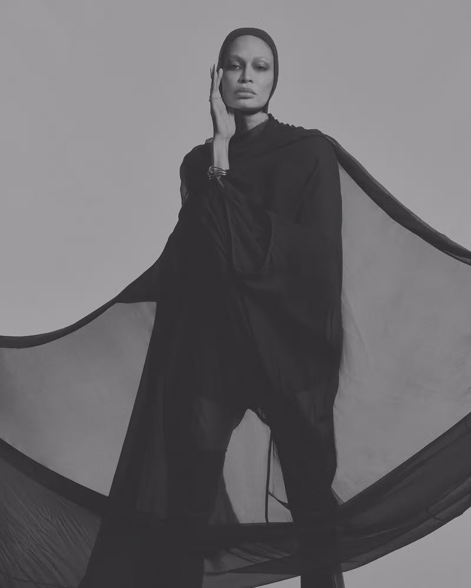 Joan wears full look by RICK OWENS and hat by HEATHER HUEY.