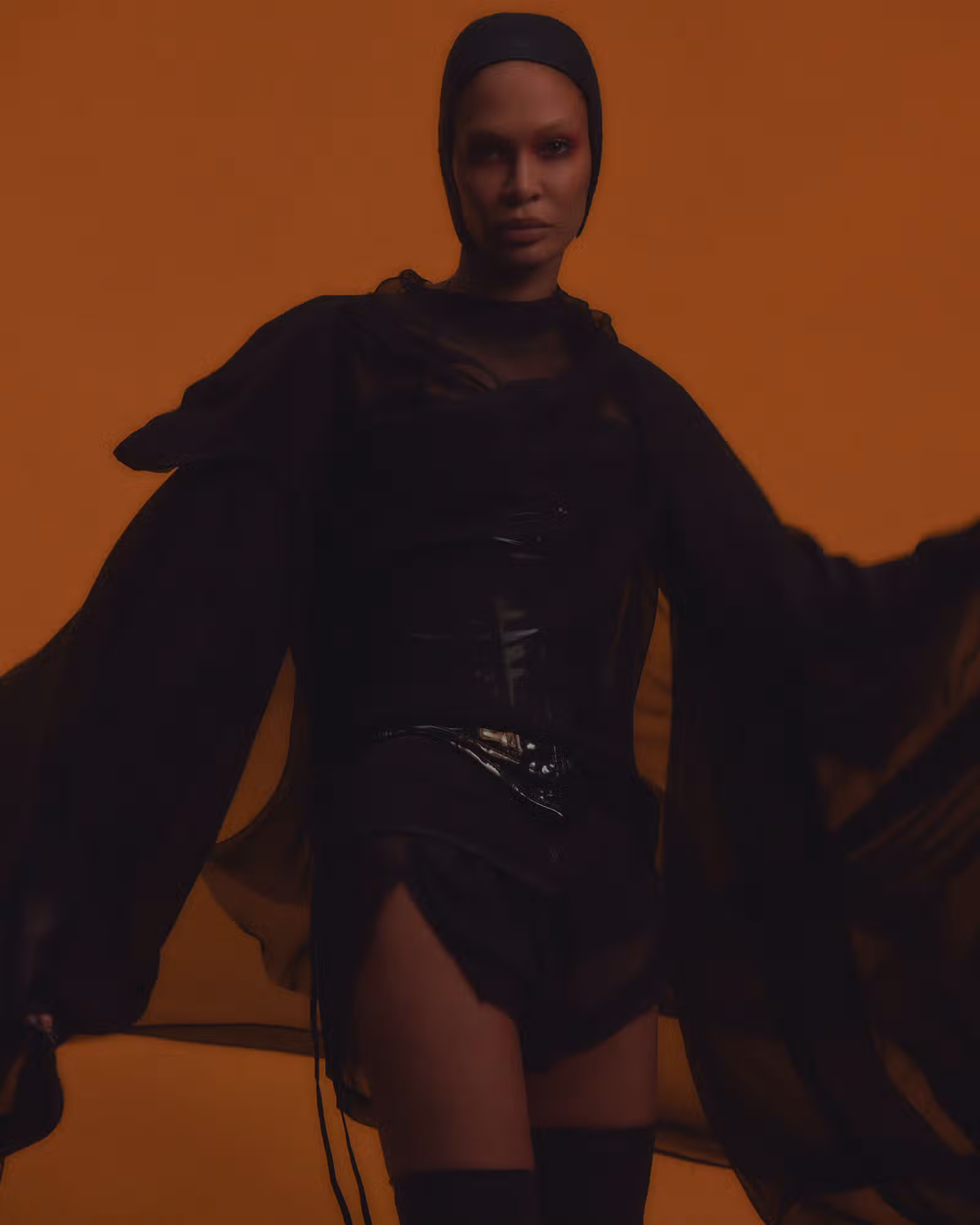 Joan wears full look by RICK OWENS and hat by HEATHER HUEY