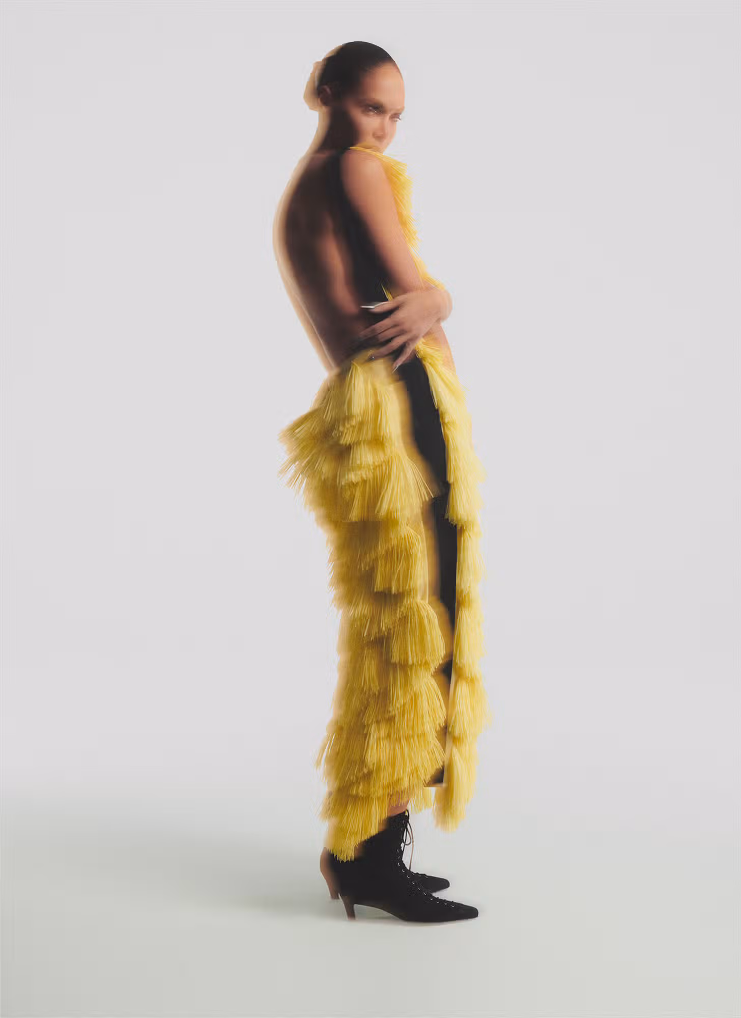 Joan wears dress by 16ARLINGTON and shoes by TOTEME.