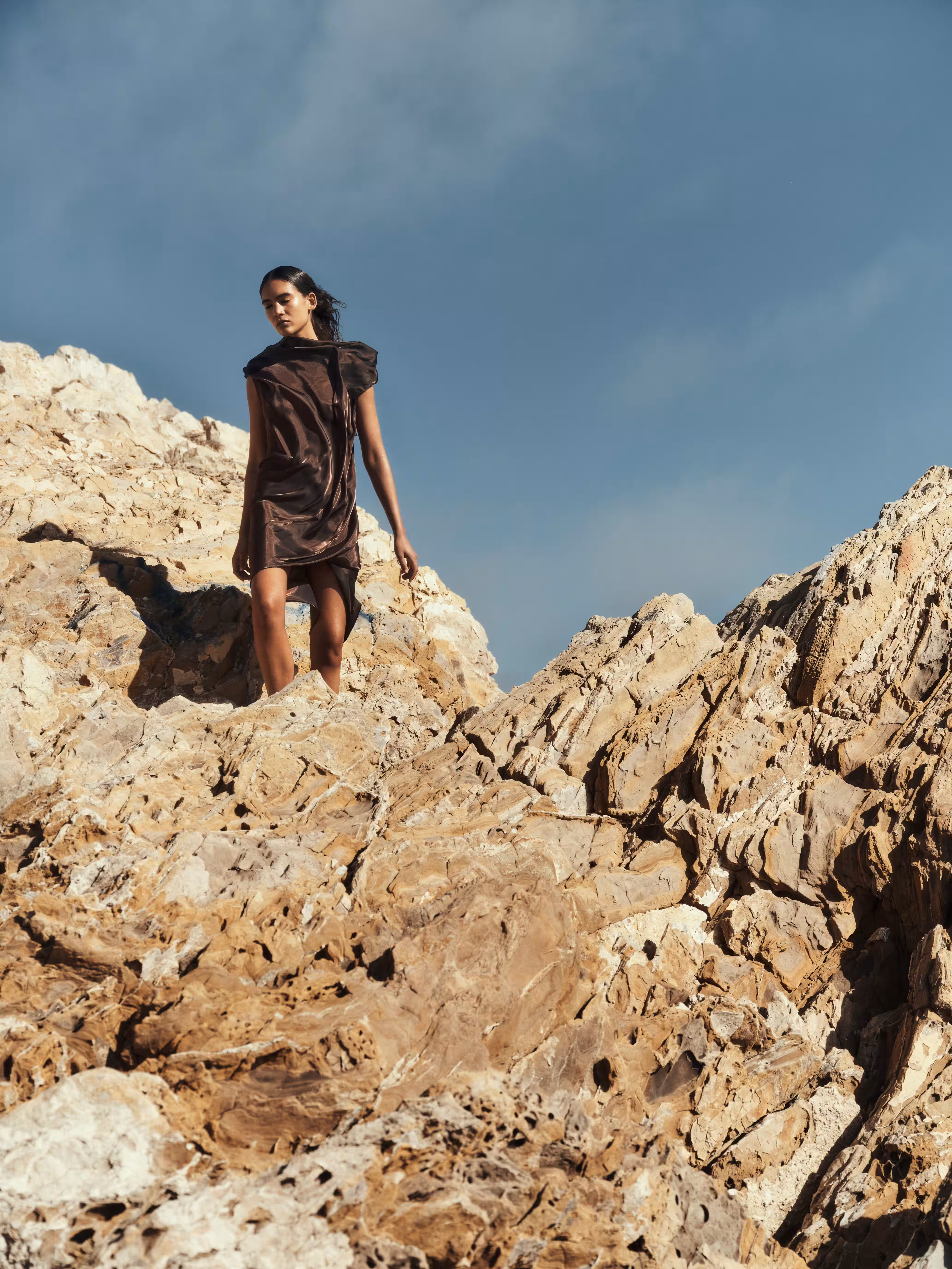 Summer Thompson wears dress by ISSEY MIYAKE.