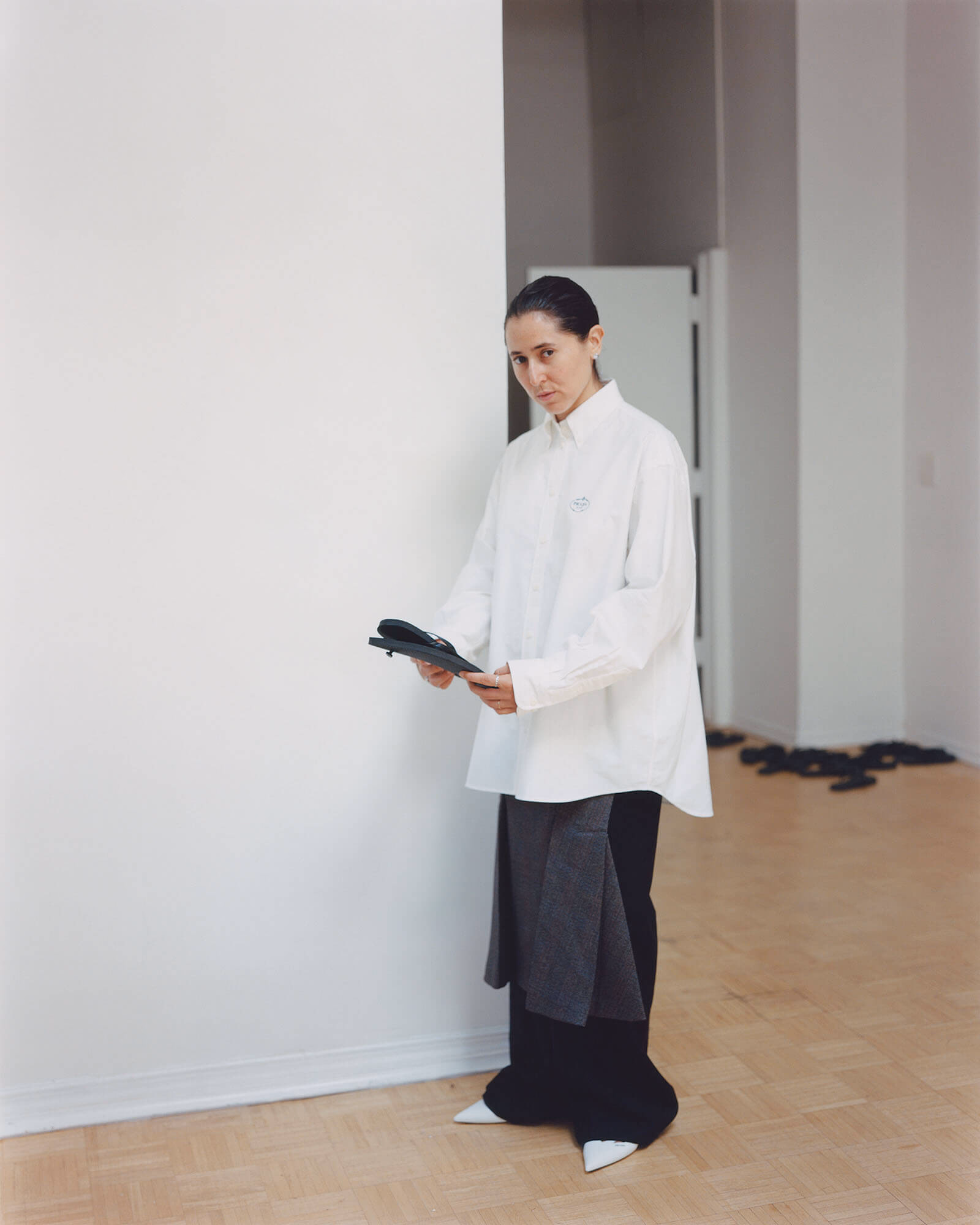 Meriem wears full look by PRADA.