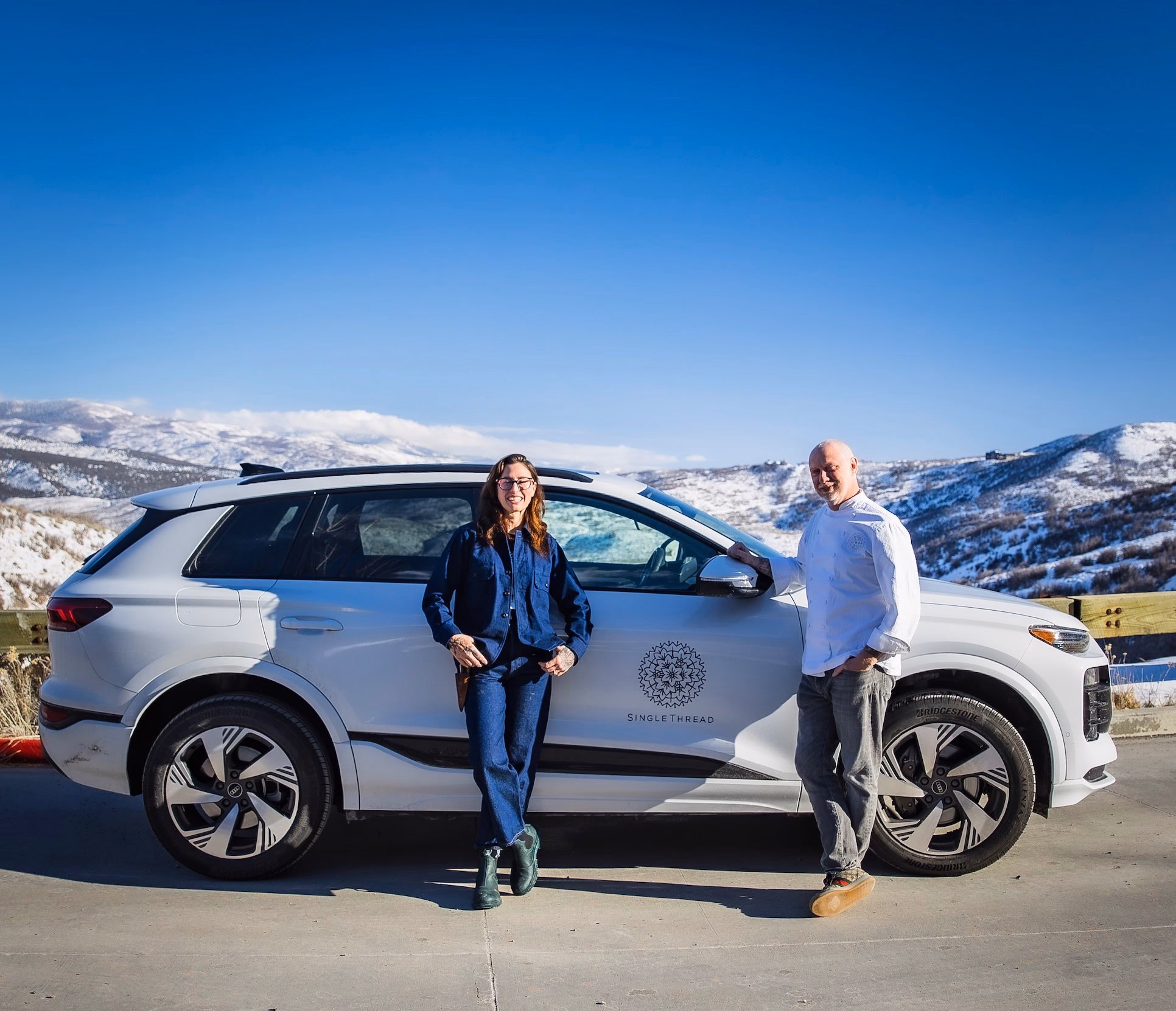 SingleThread co-founders Kyle and Katina Connaughton in front of the fully electric Audi Q6 e-tron. Photography by John Troxell.